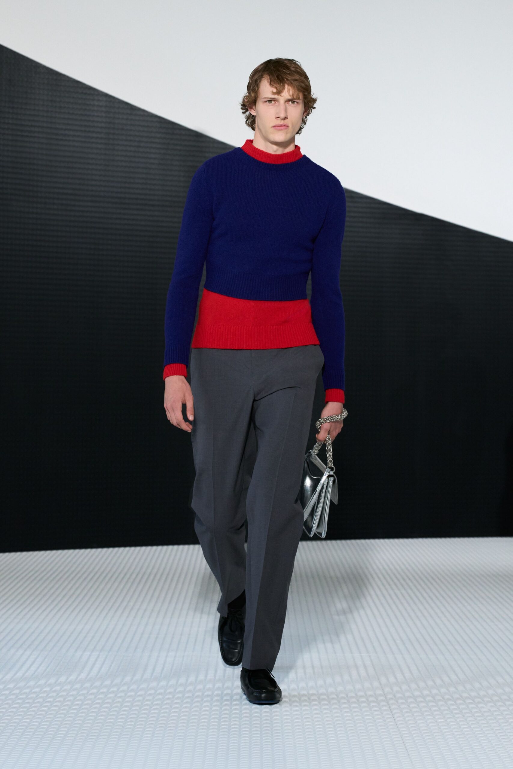 blue and red fitted sweater with tailored pants