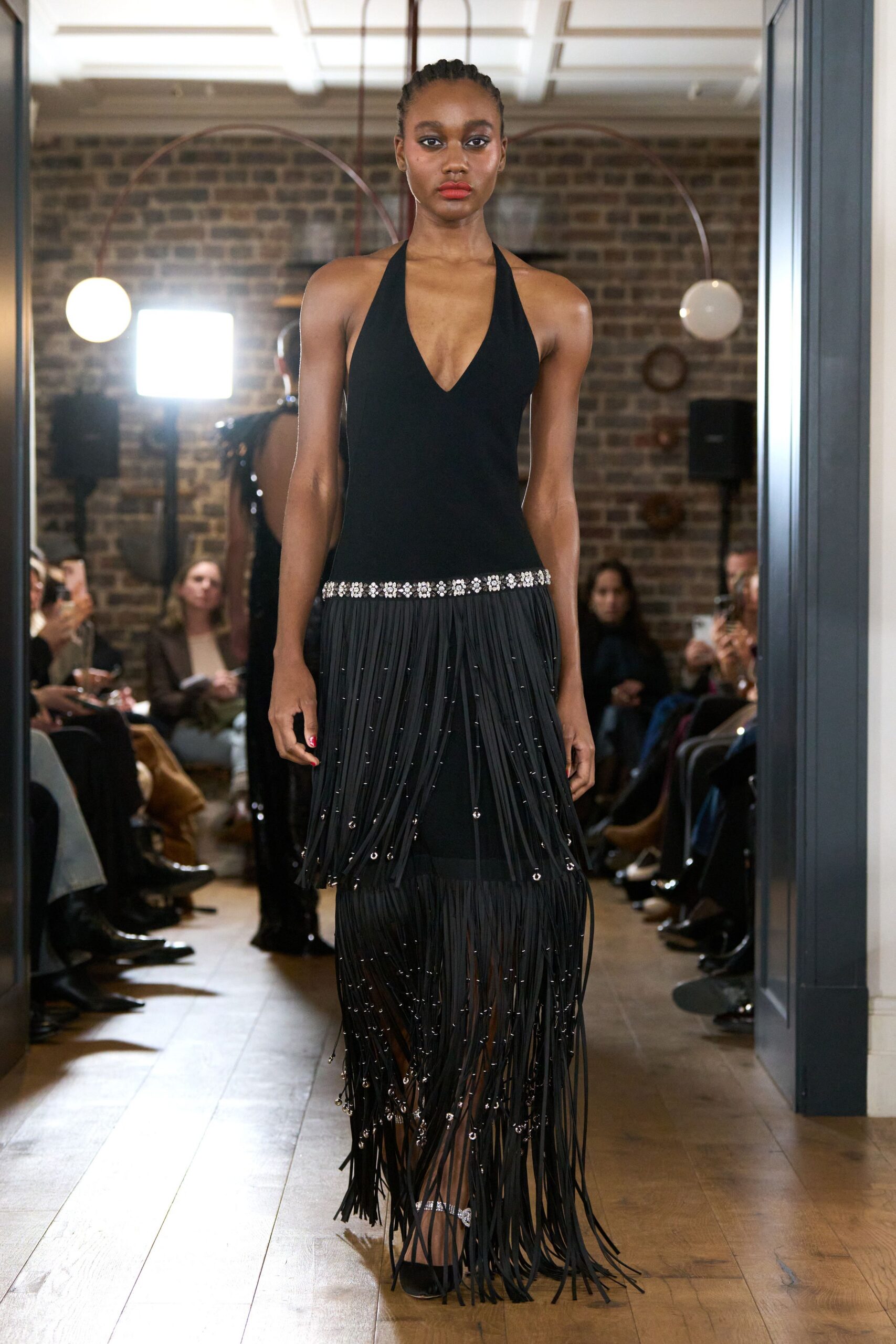 black fringed maxi dress and heels