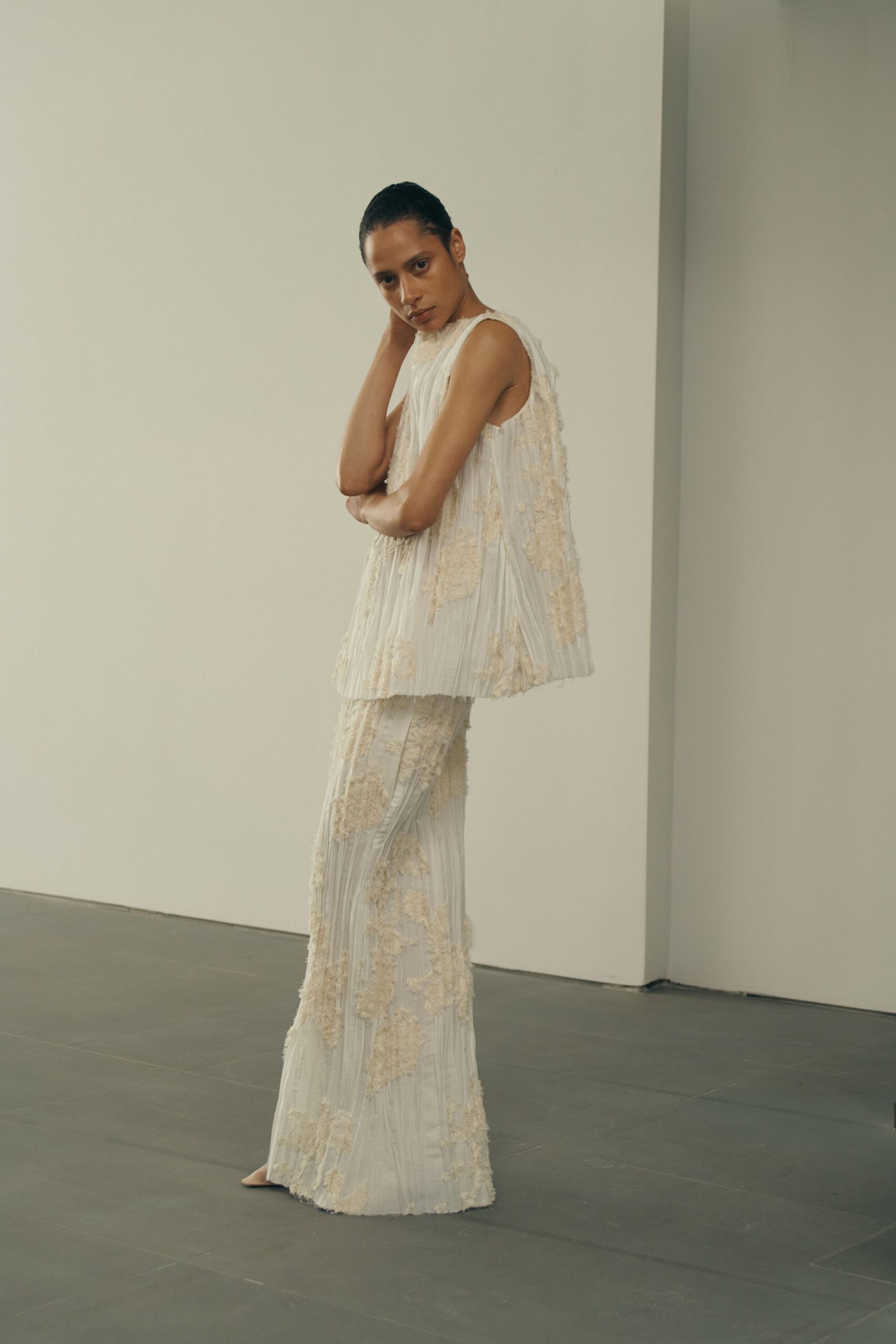 white pleated embroidered top and pants