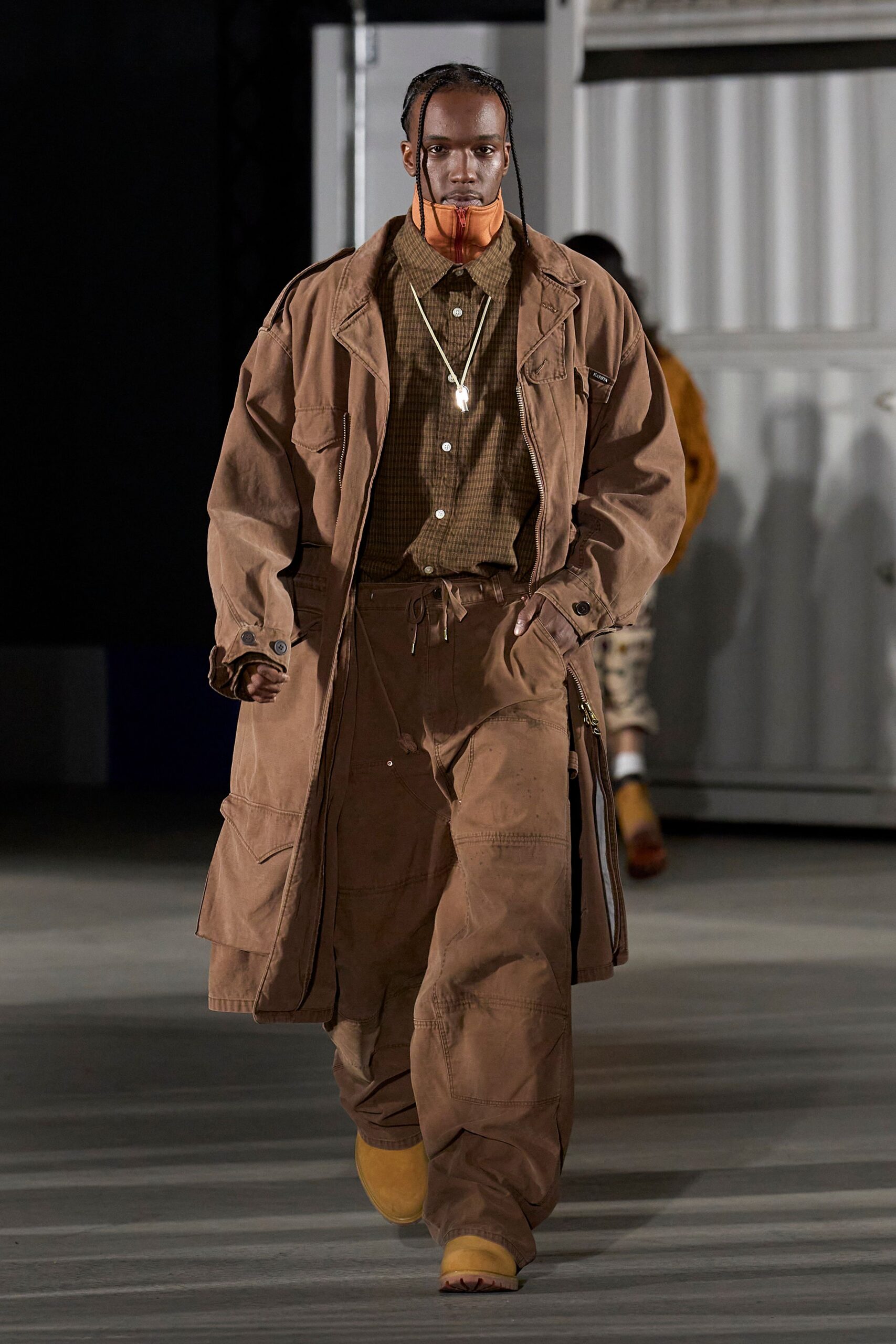 brown relaxed coat with yellow shoes