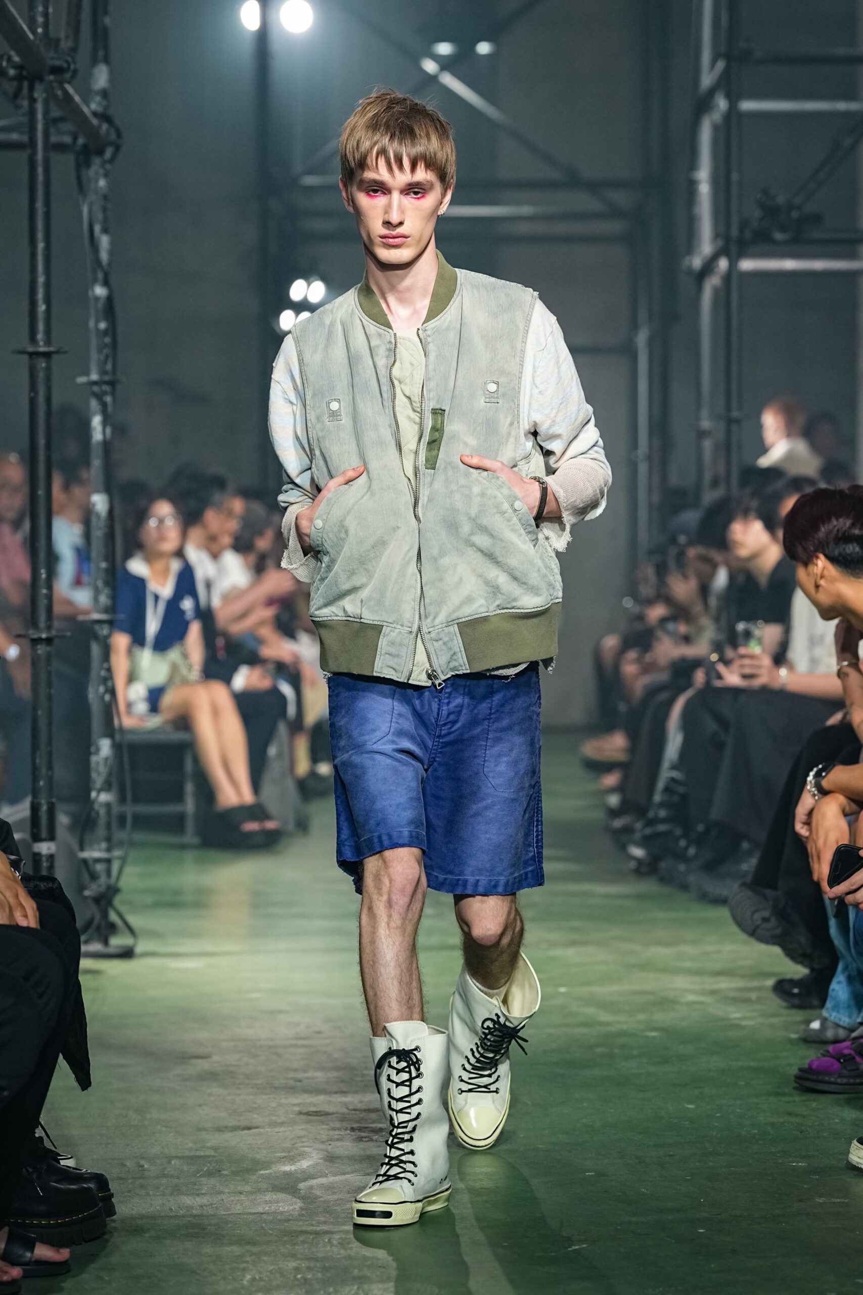gray jacket green t-shirt denim shorts