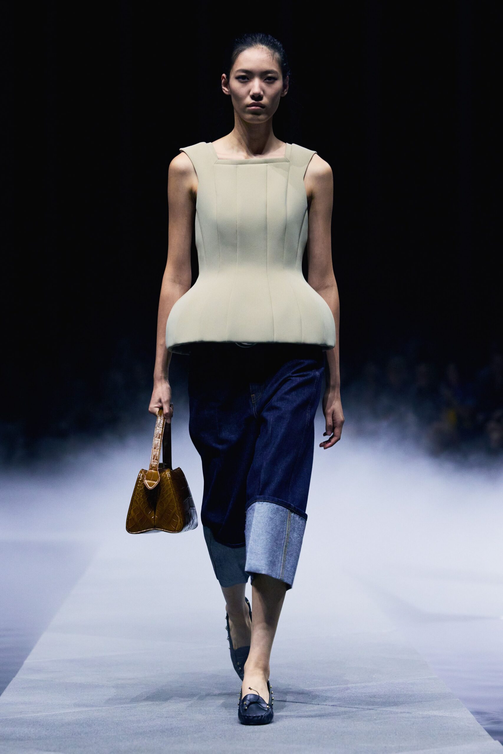 beige fitted top with blue denim pants