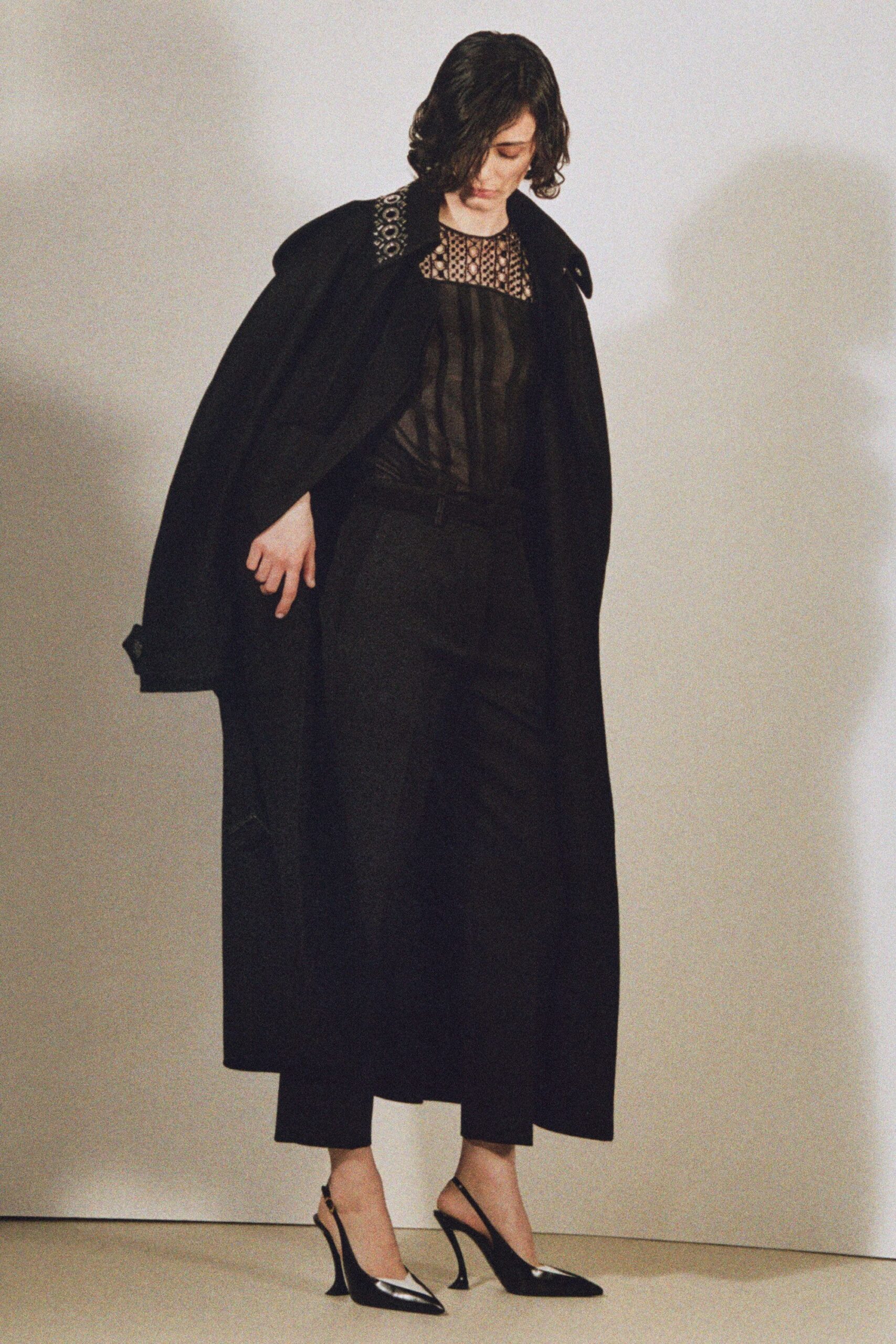 black wool coat with sheer top