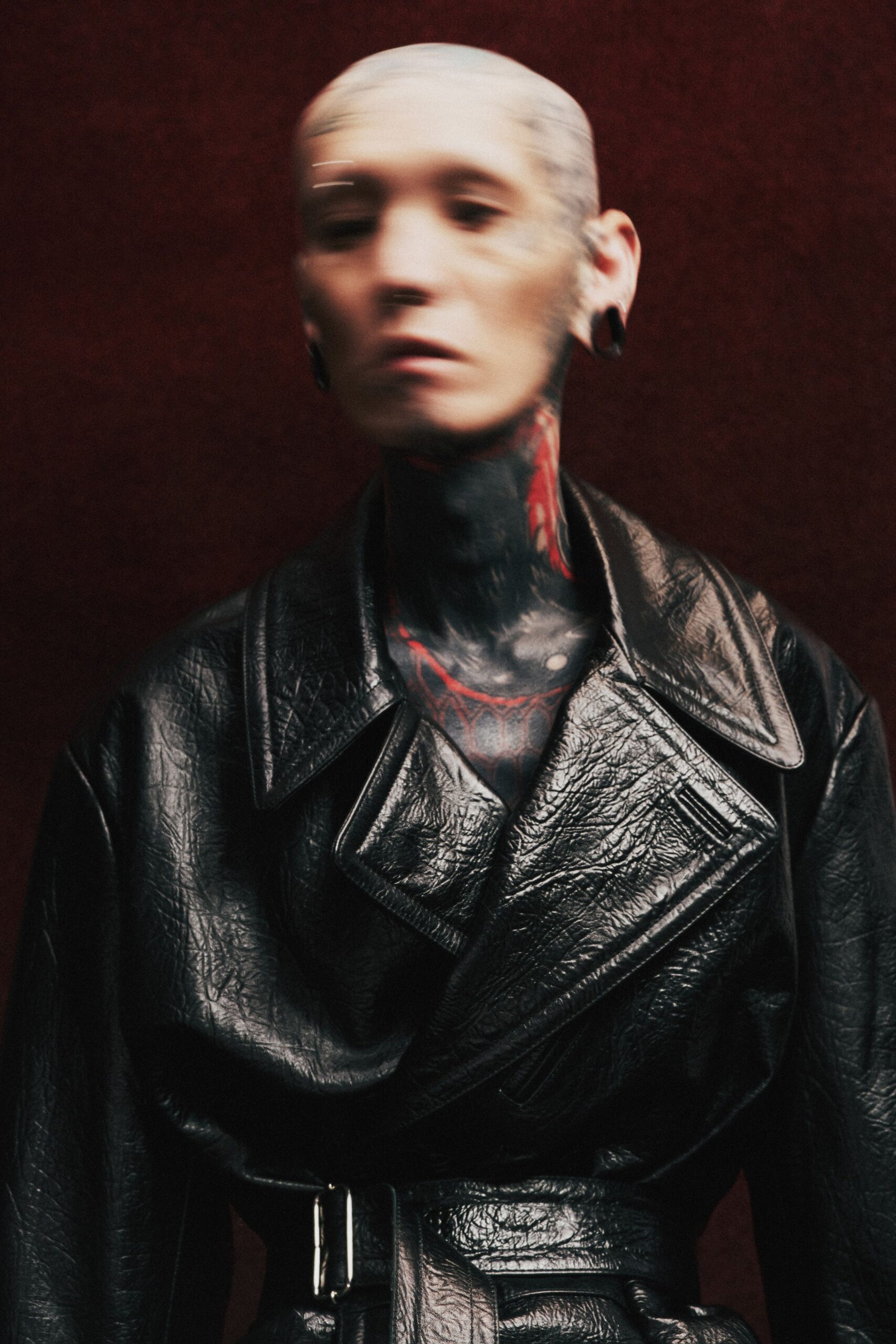 black leather belted coat