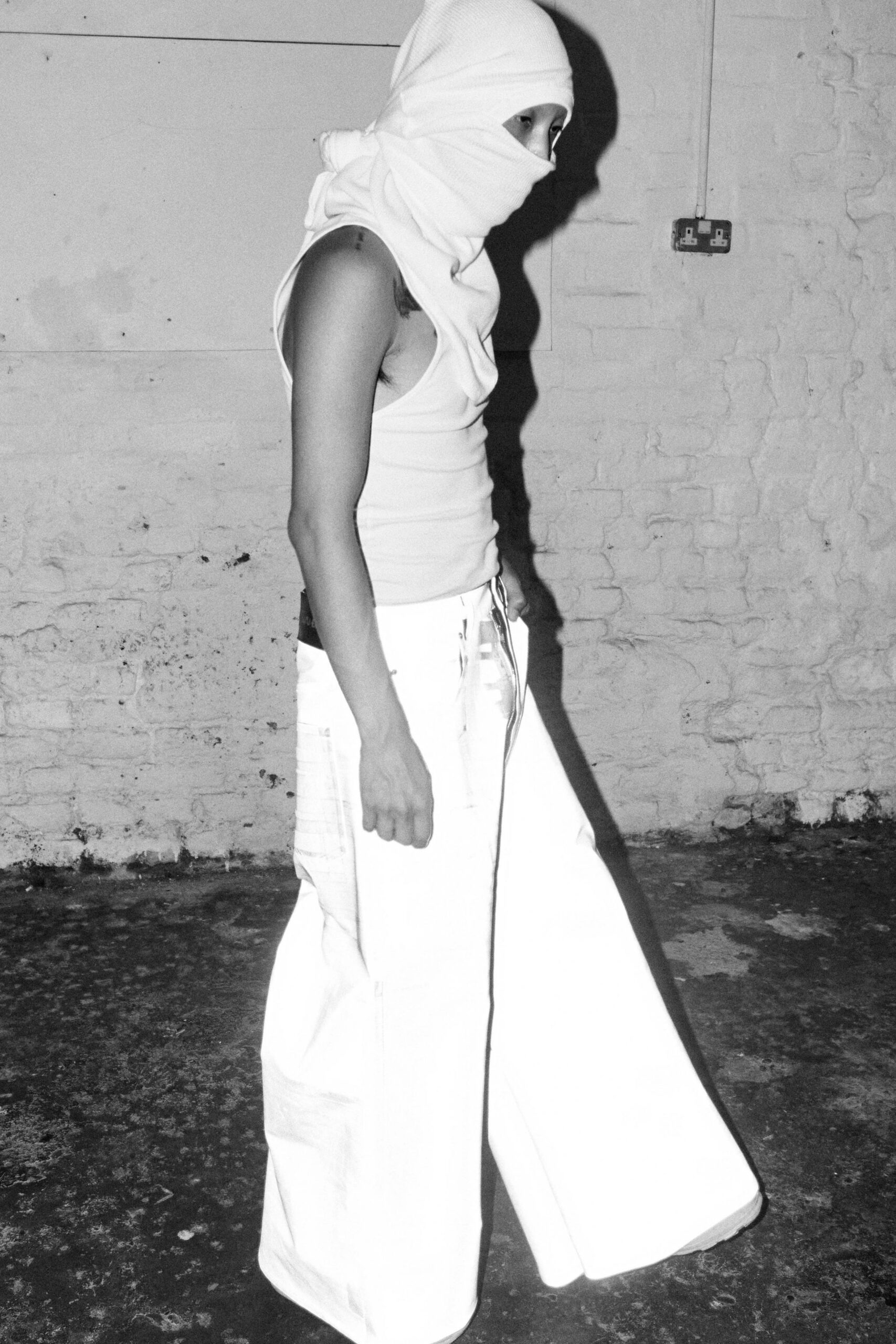 white tank-top and wide-leg pants