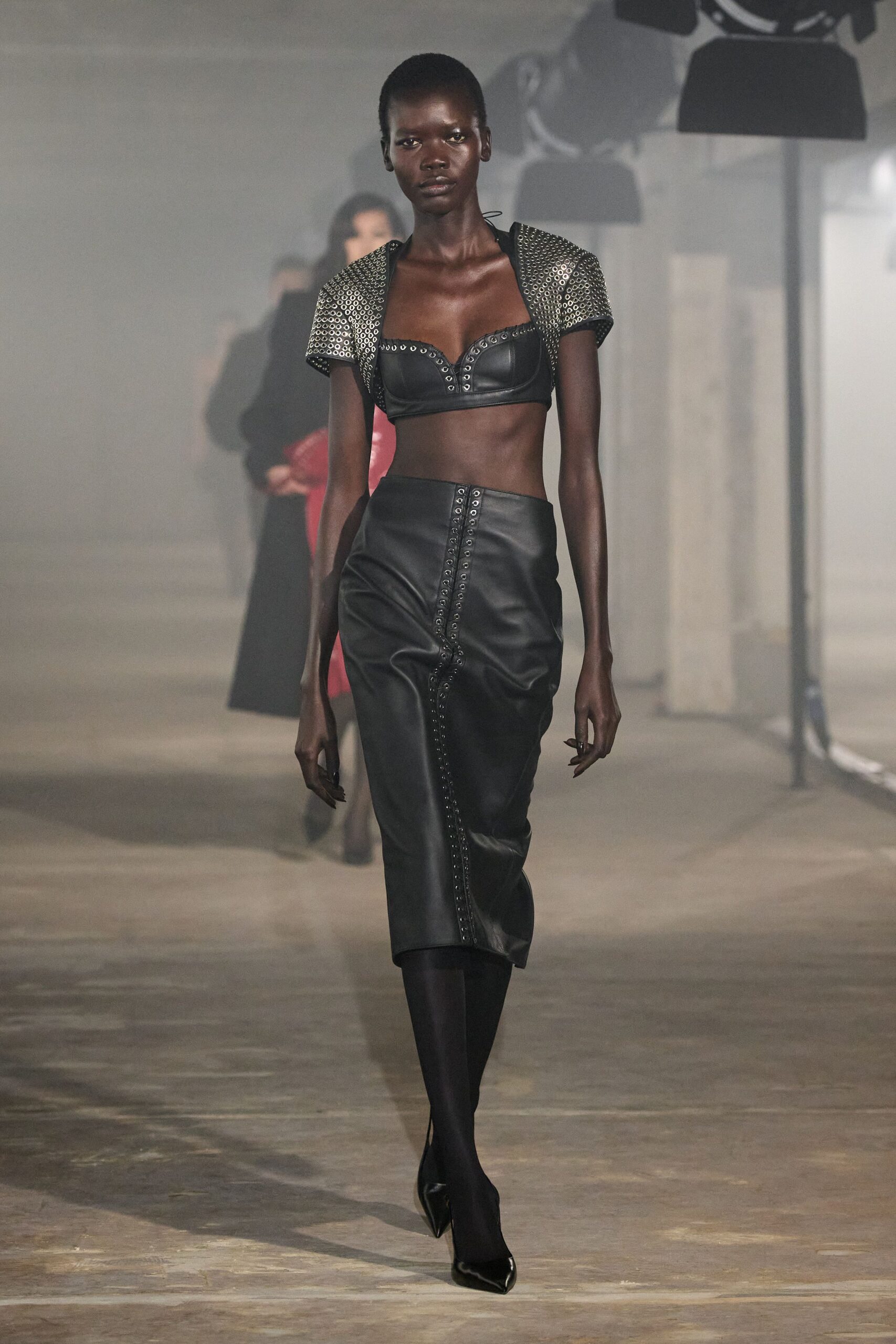 black leather fitted top and skirt