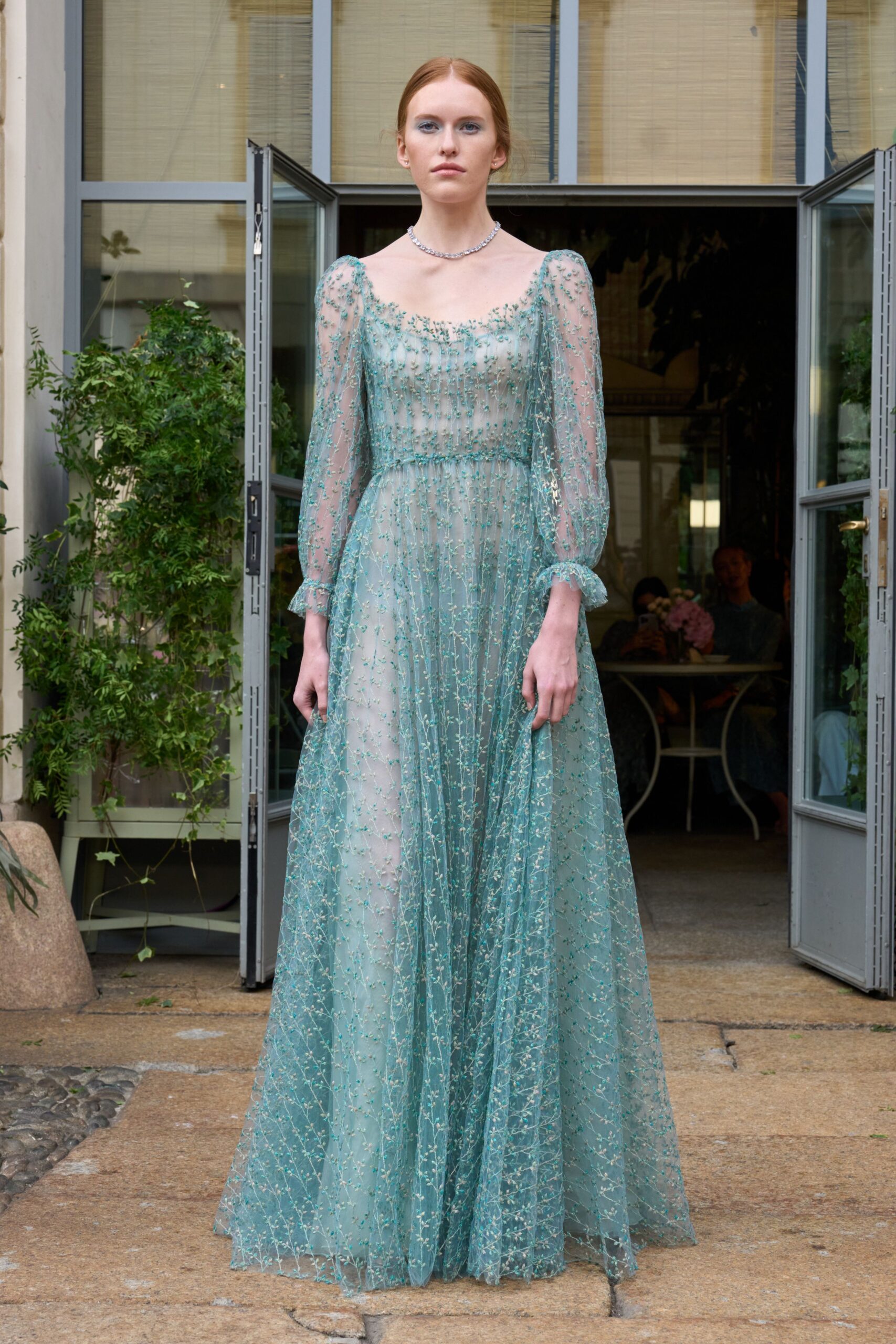 teal embroidered long-sleeve gown