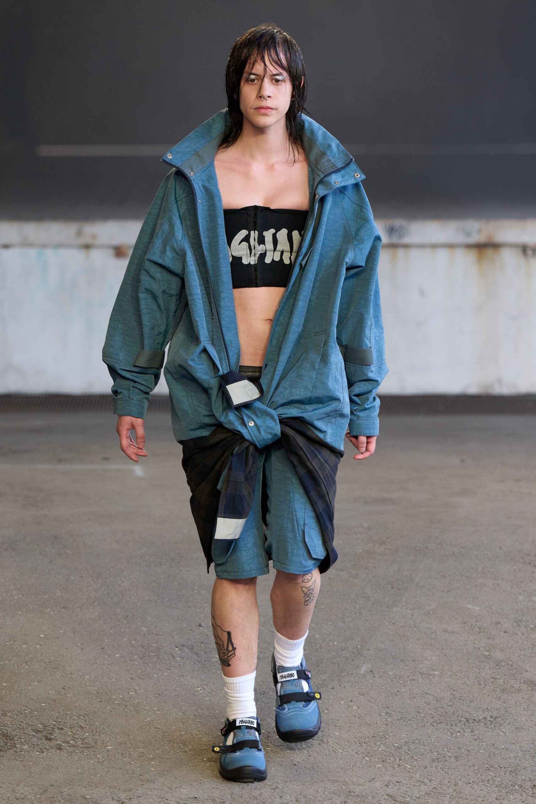 blue relaxed jacket with black top and shorts