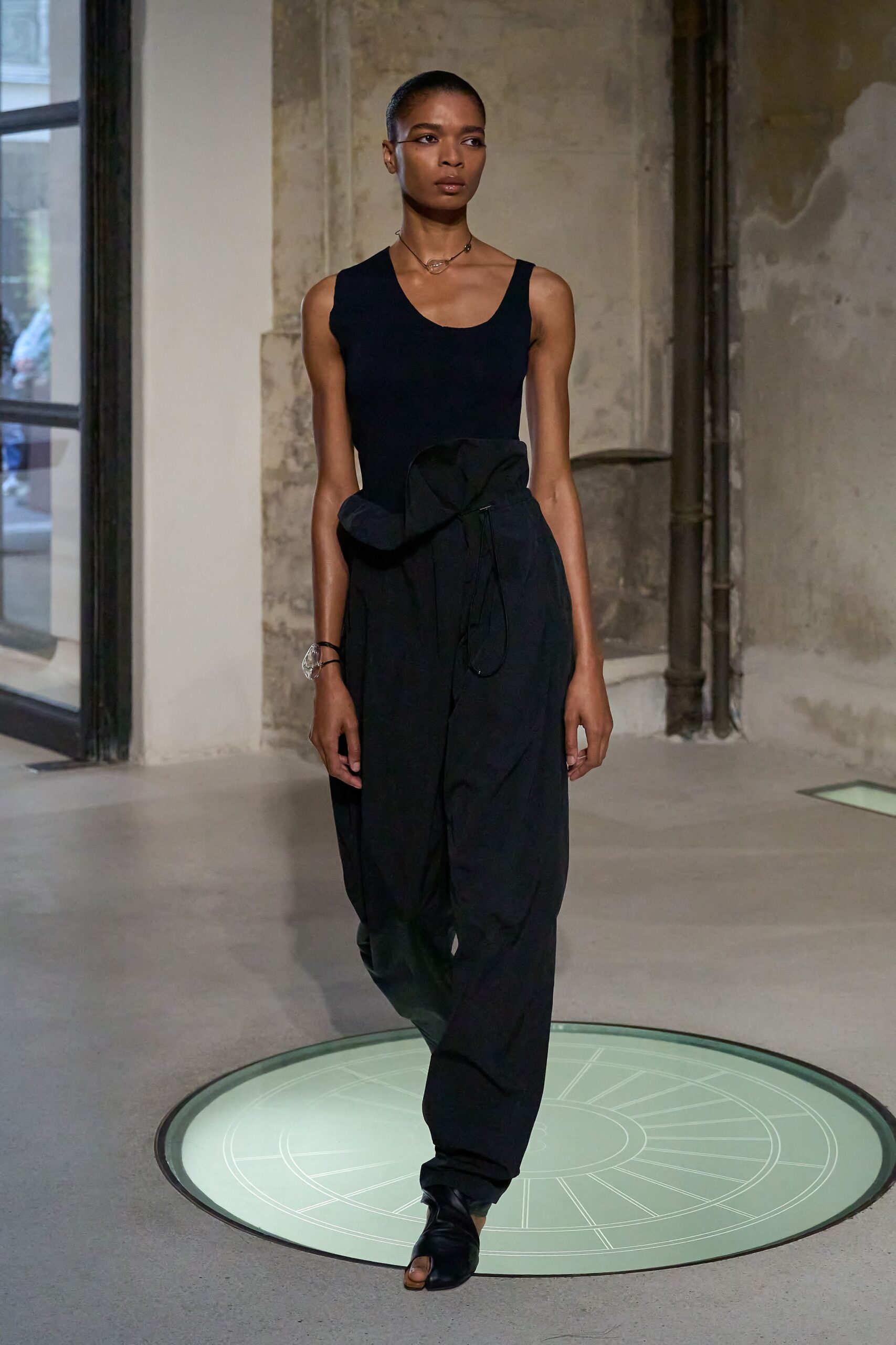 black fitted top and relaxed pants