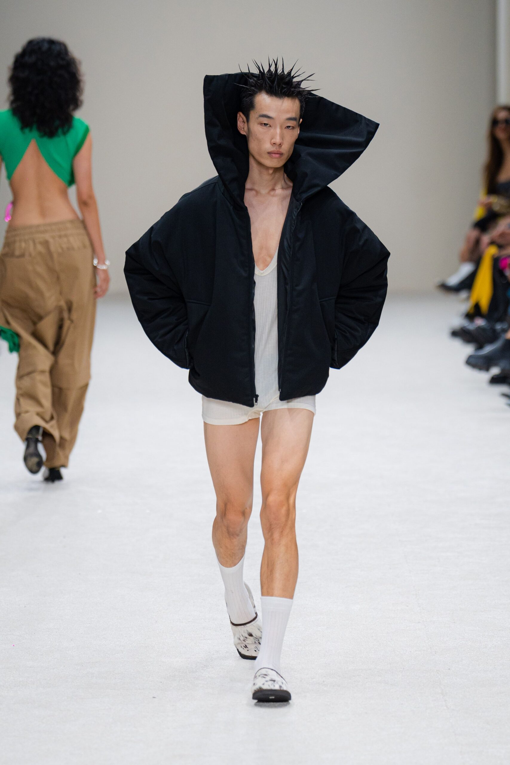 black oversized hoodie with white tank-top and shorts