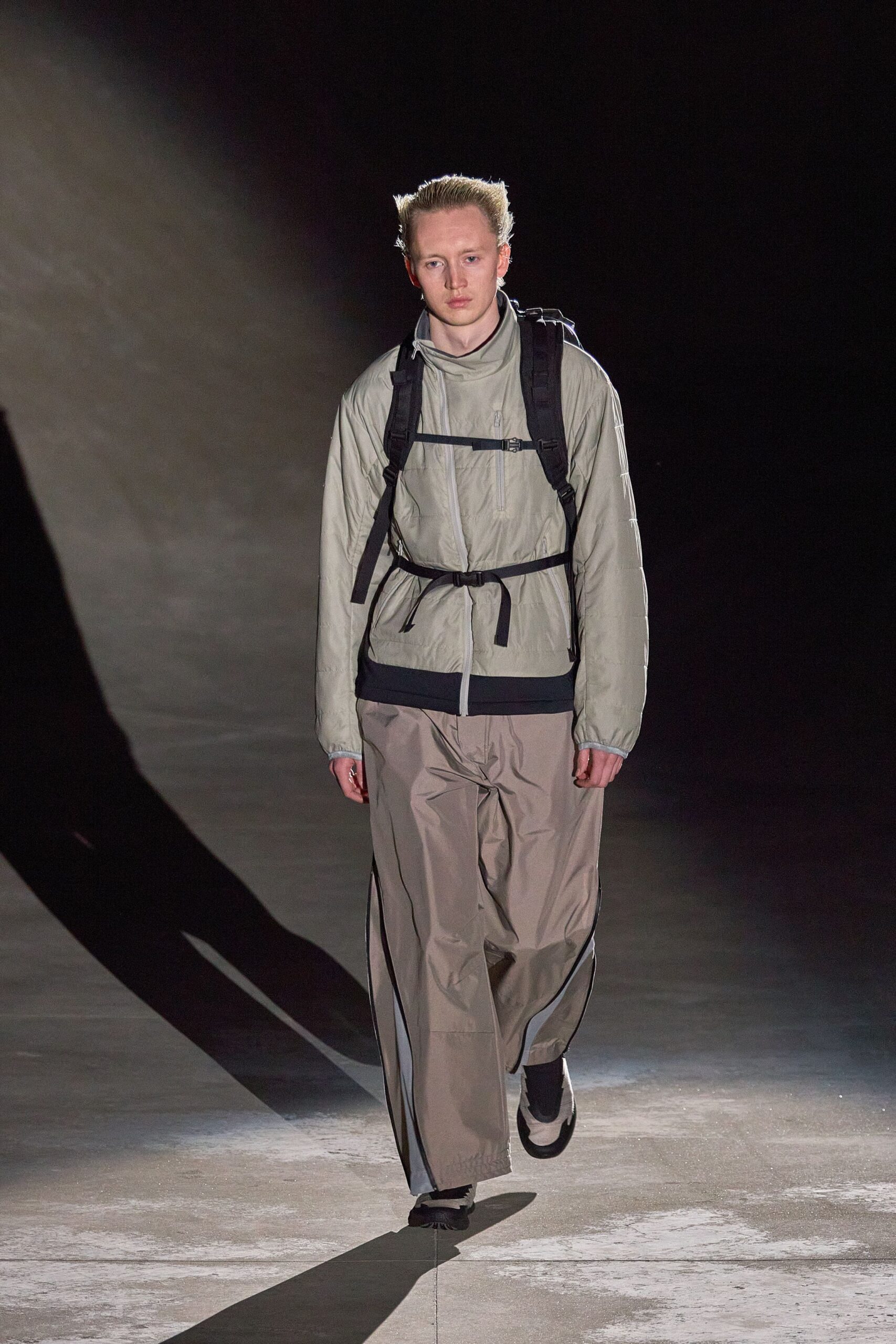 beige jacket gray pants black shoes