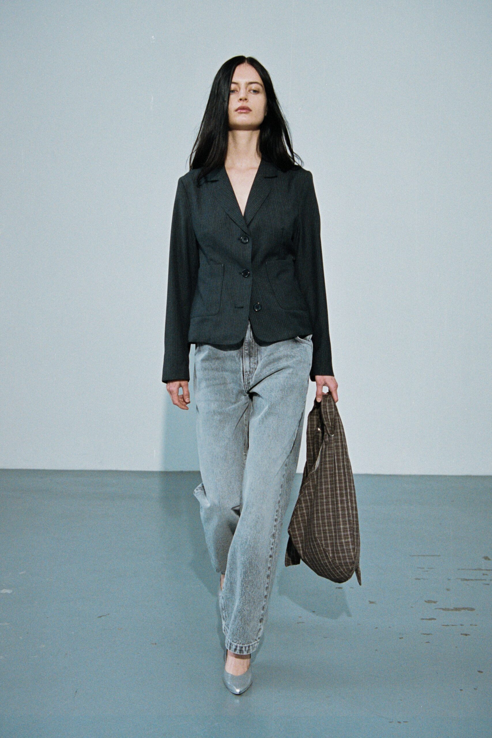 black tailored blazer with gray pants