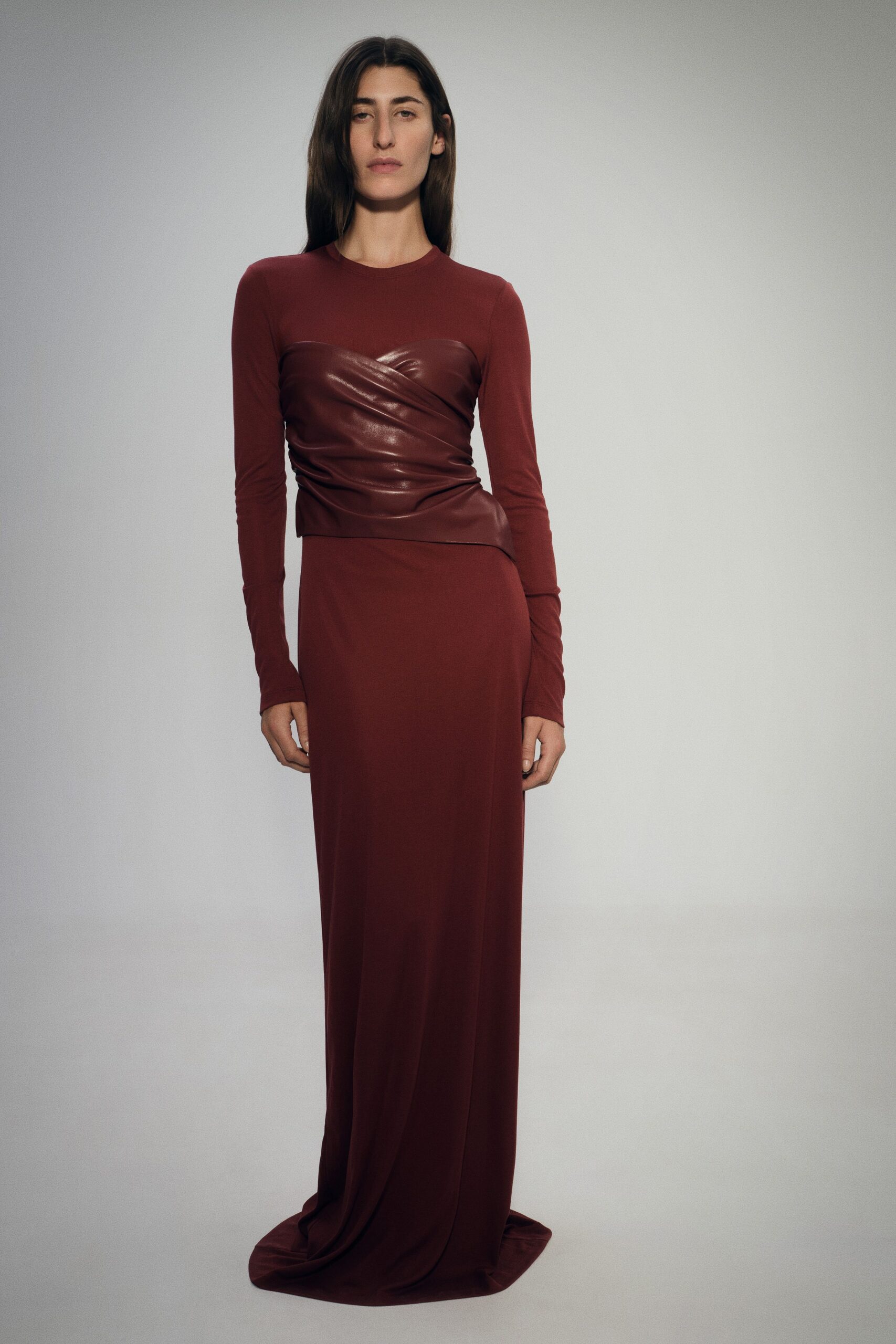fitted red gown with leather detail
