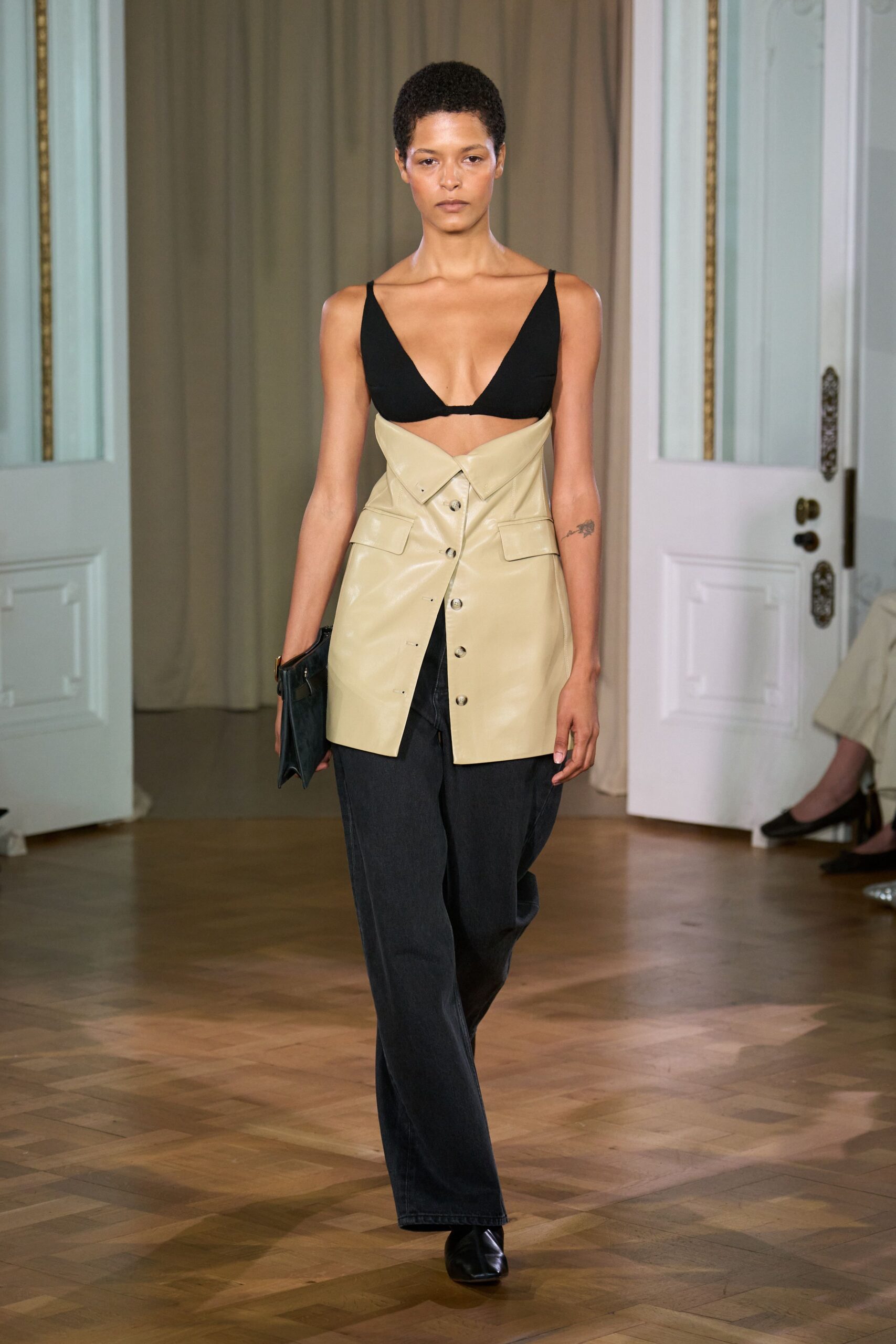 black vinyl sleeveless v-neck fitted buttoned top