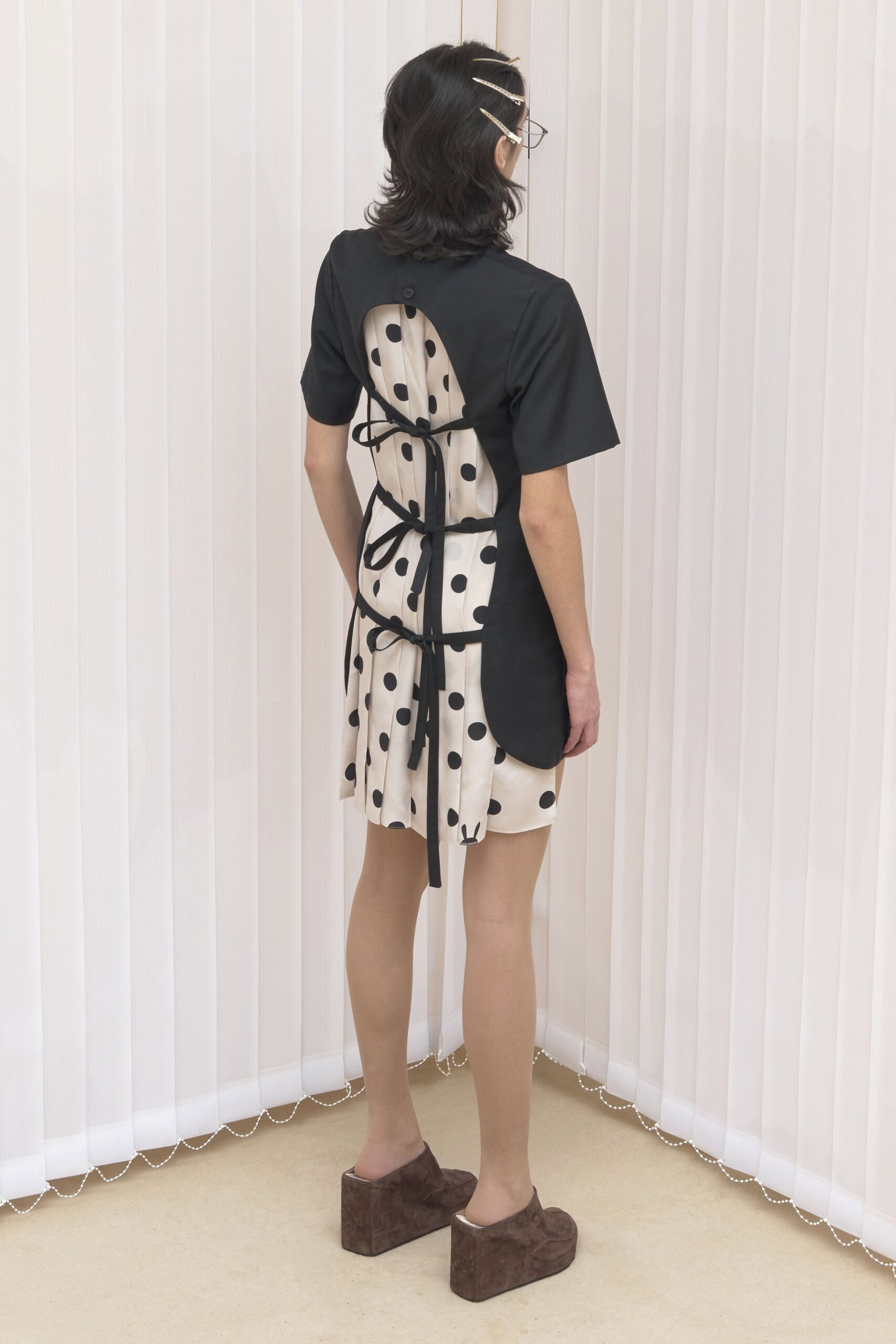 black and white polka-dot mini dress with platform shoes