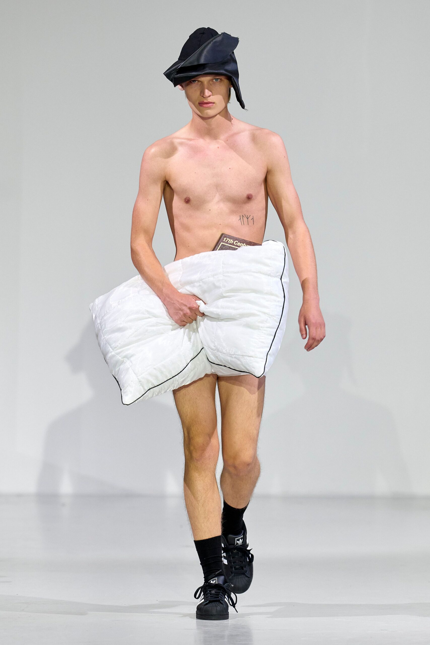 black hat white padded shorts