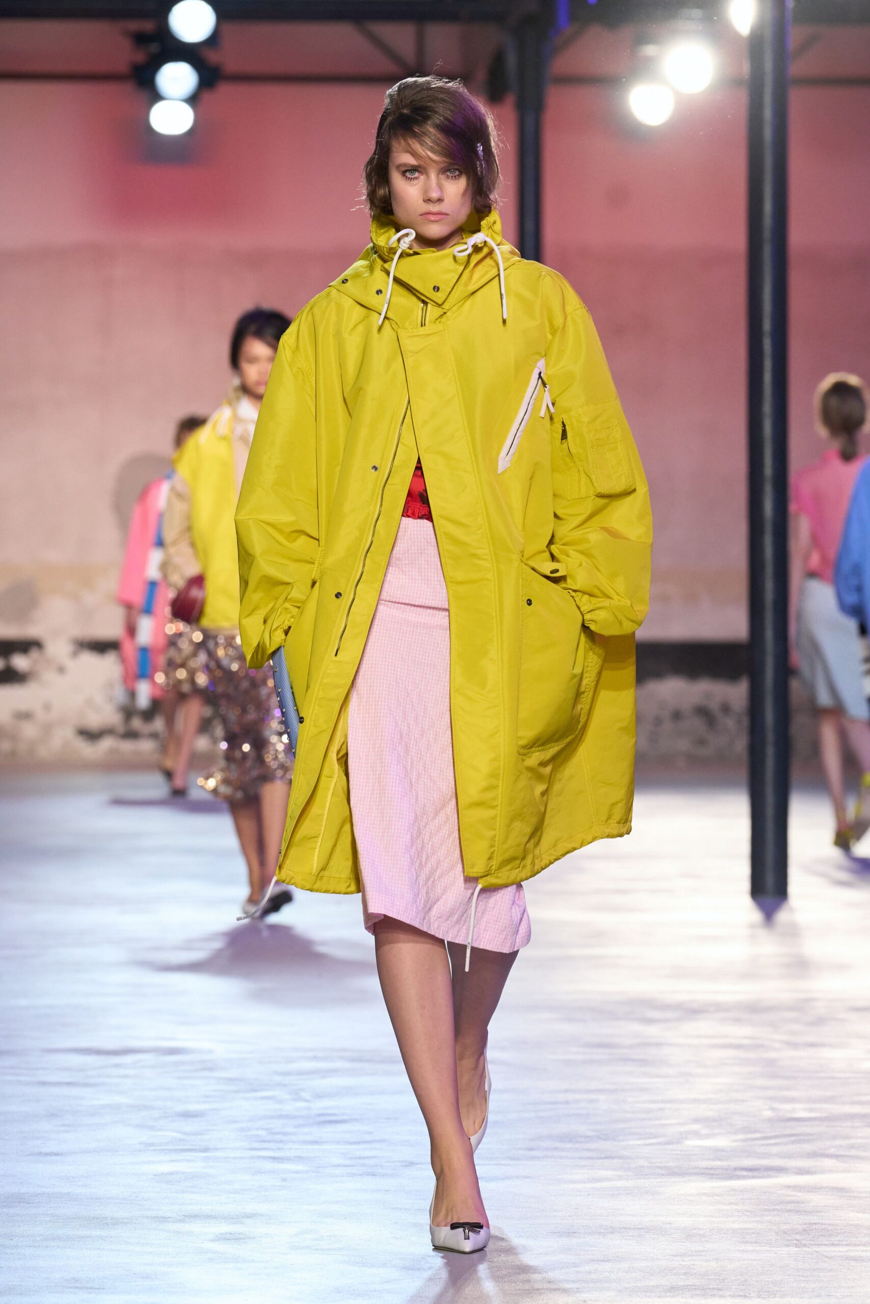 yellow oversized coat pink midi skirt