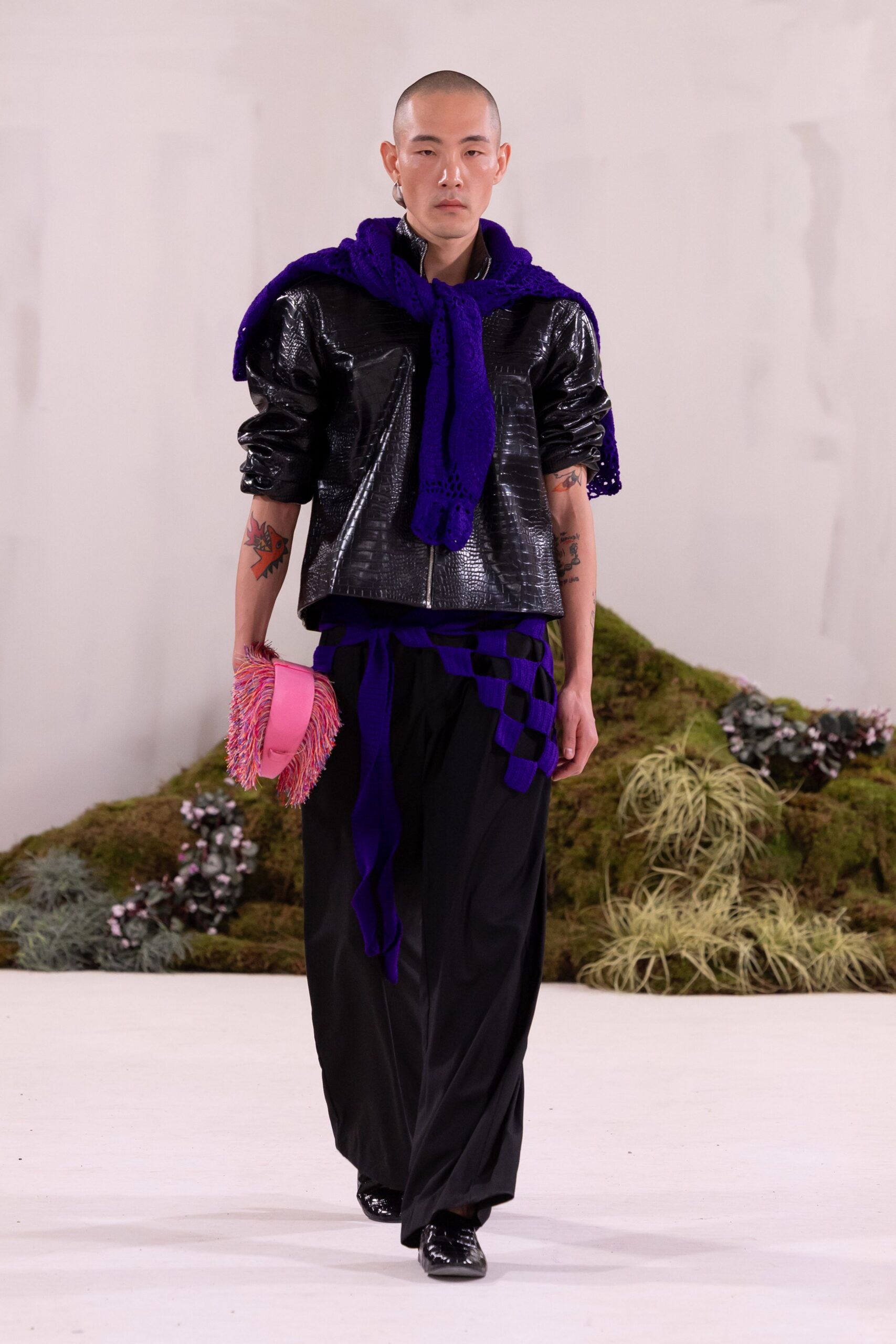 black leather jacket with purple sweater