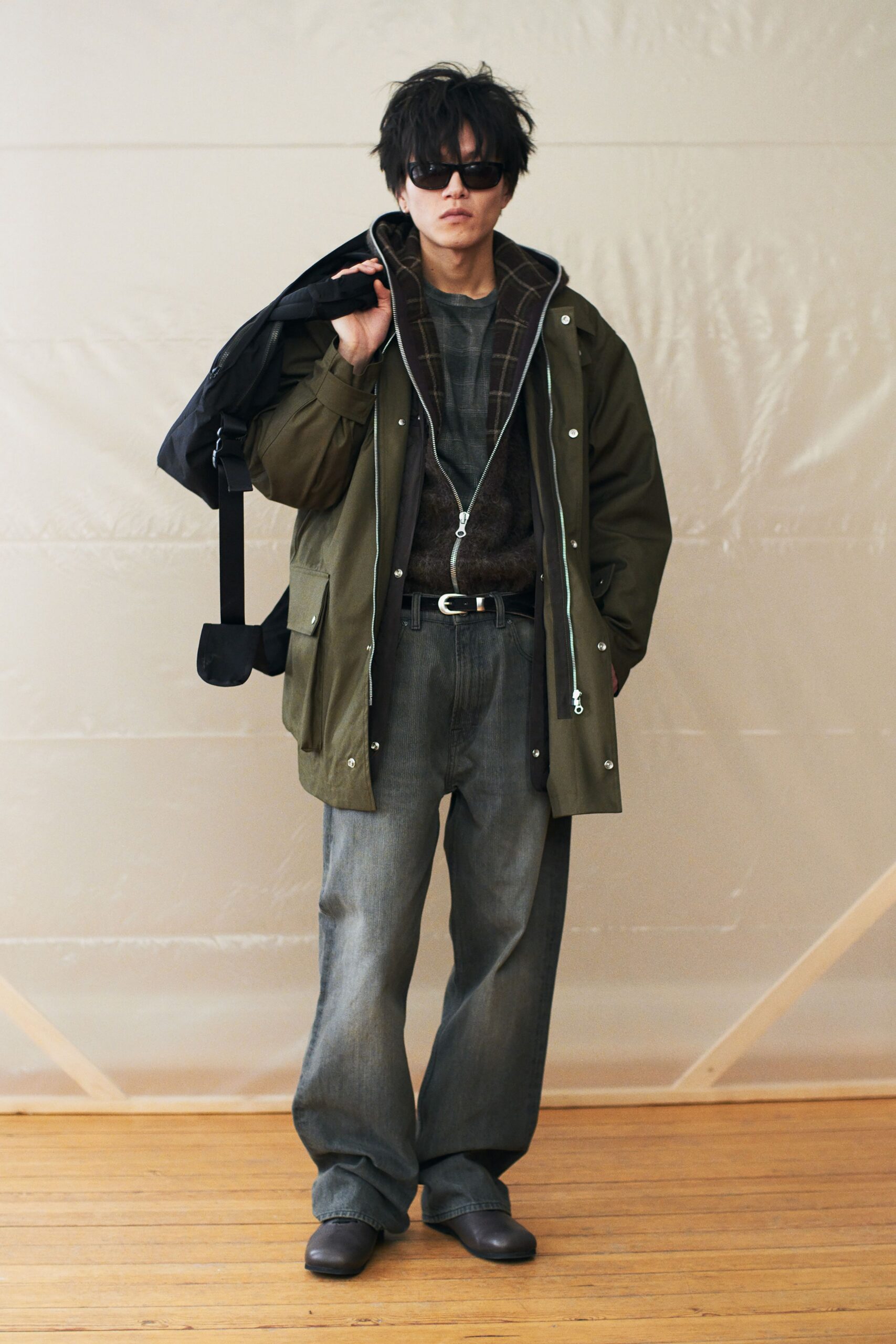 green jacket brown sweater gray pants