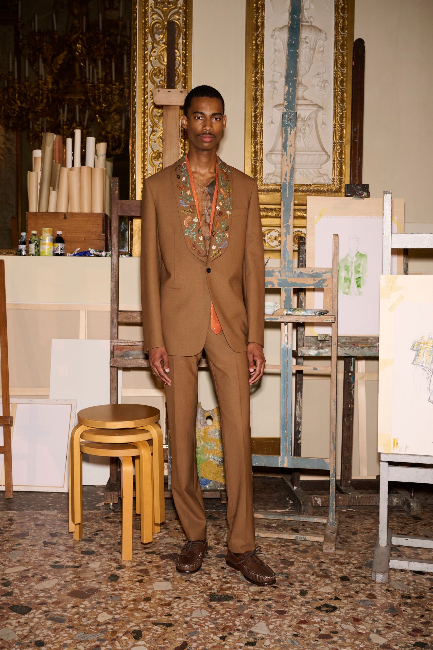 brown tailored suit with embroidered shirt