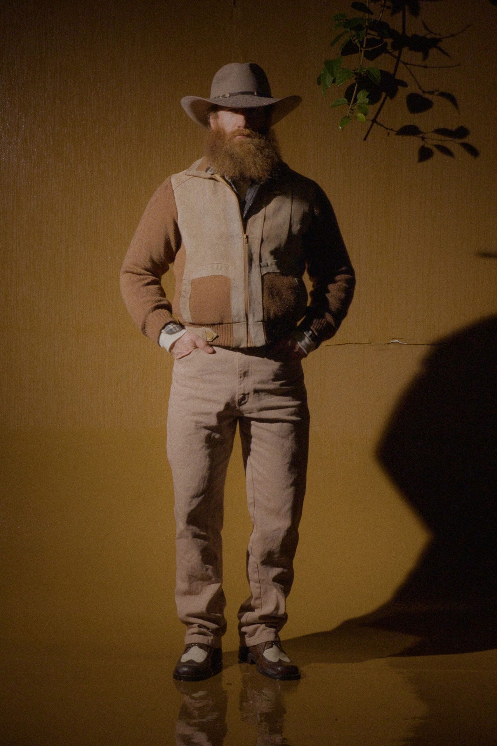 brown patchwork jacket with beige pants