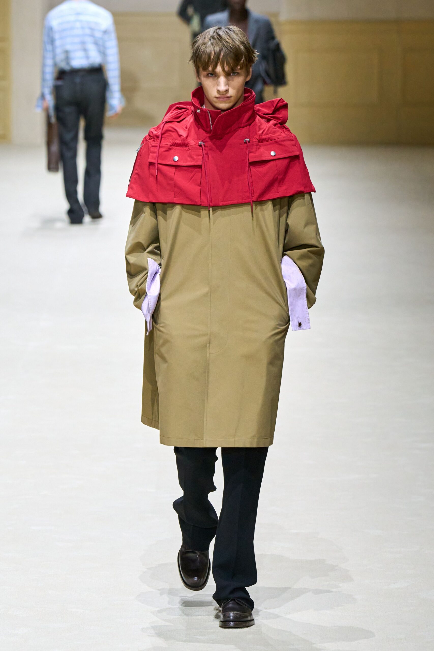 beige and red relaxed coat with black pants