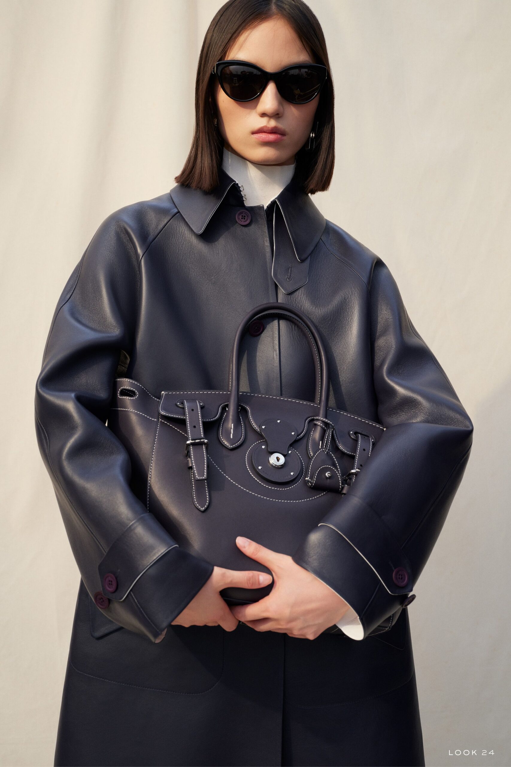 navy leather coat with white shirt