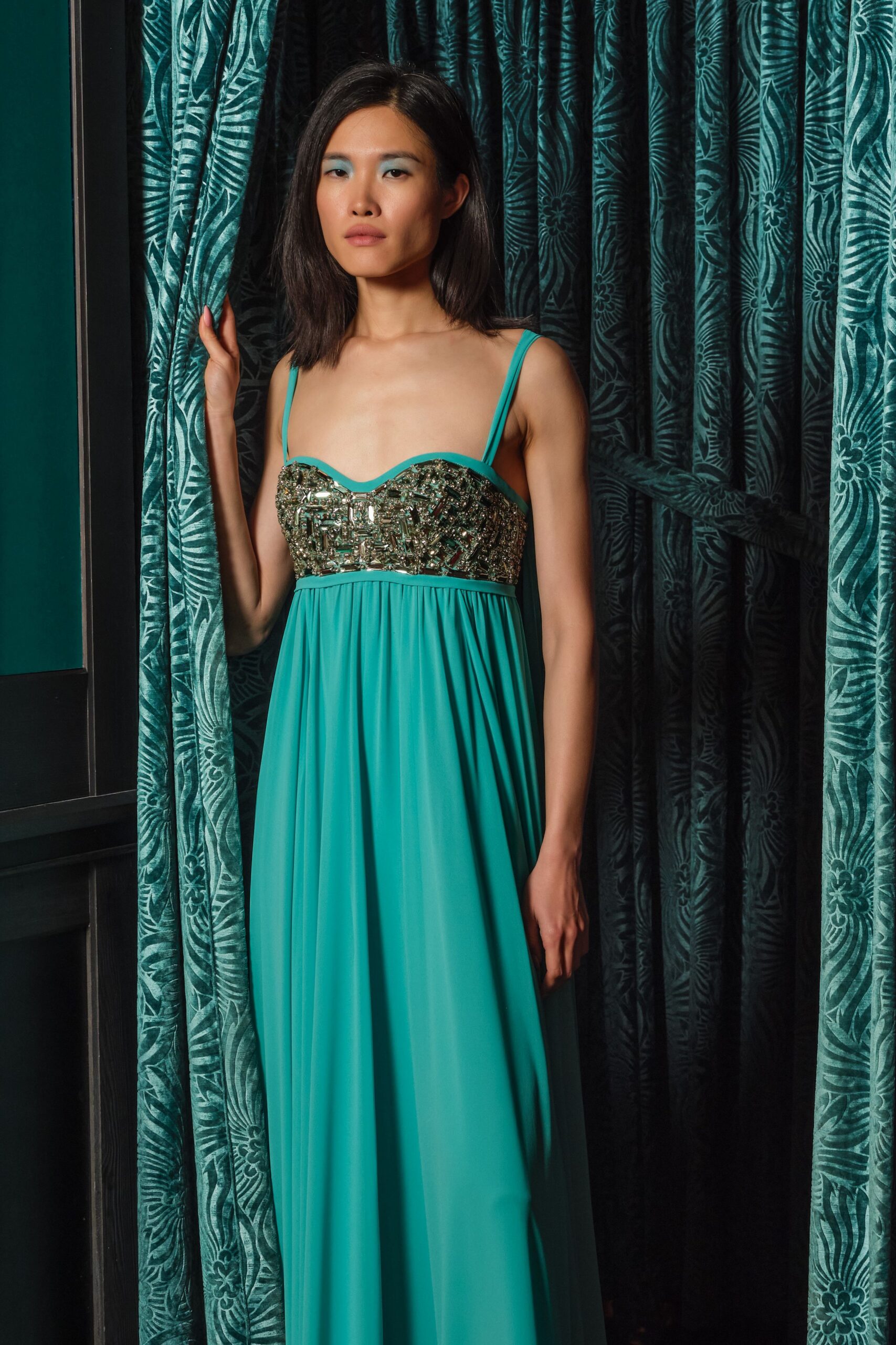 teal sleeveless embellished gown