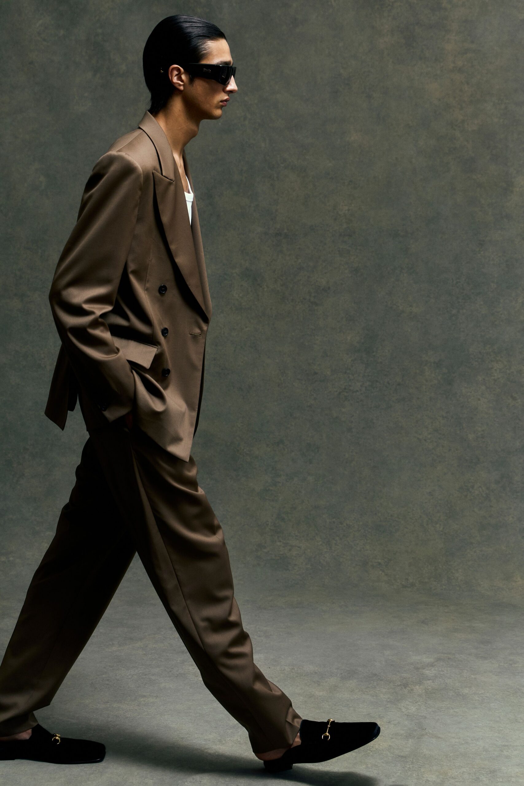 brown tailored suit with sunglasses