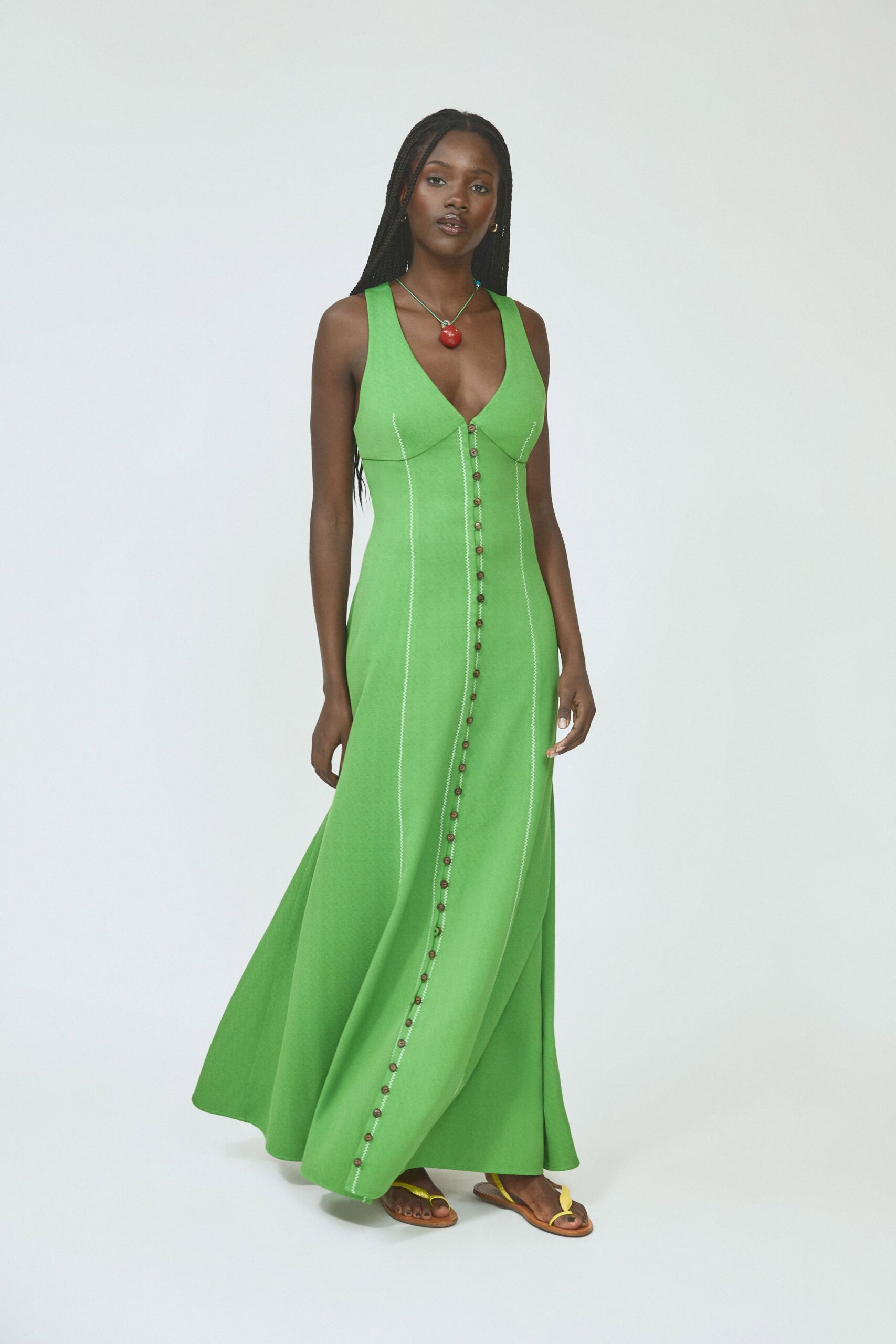 green cotton sleeveless v-neck fitted buttoned flared gown
