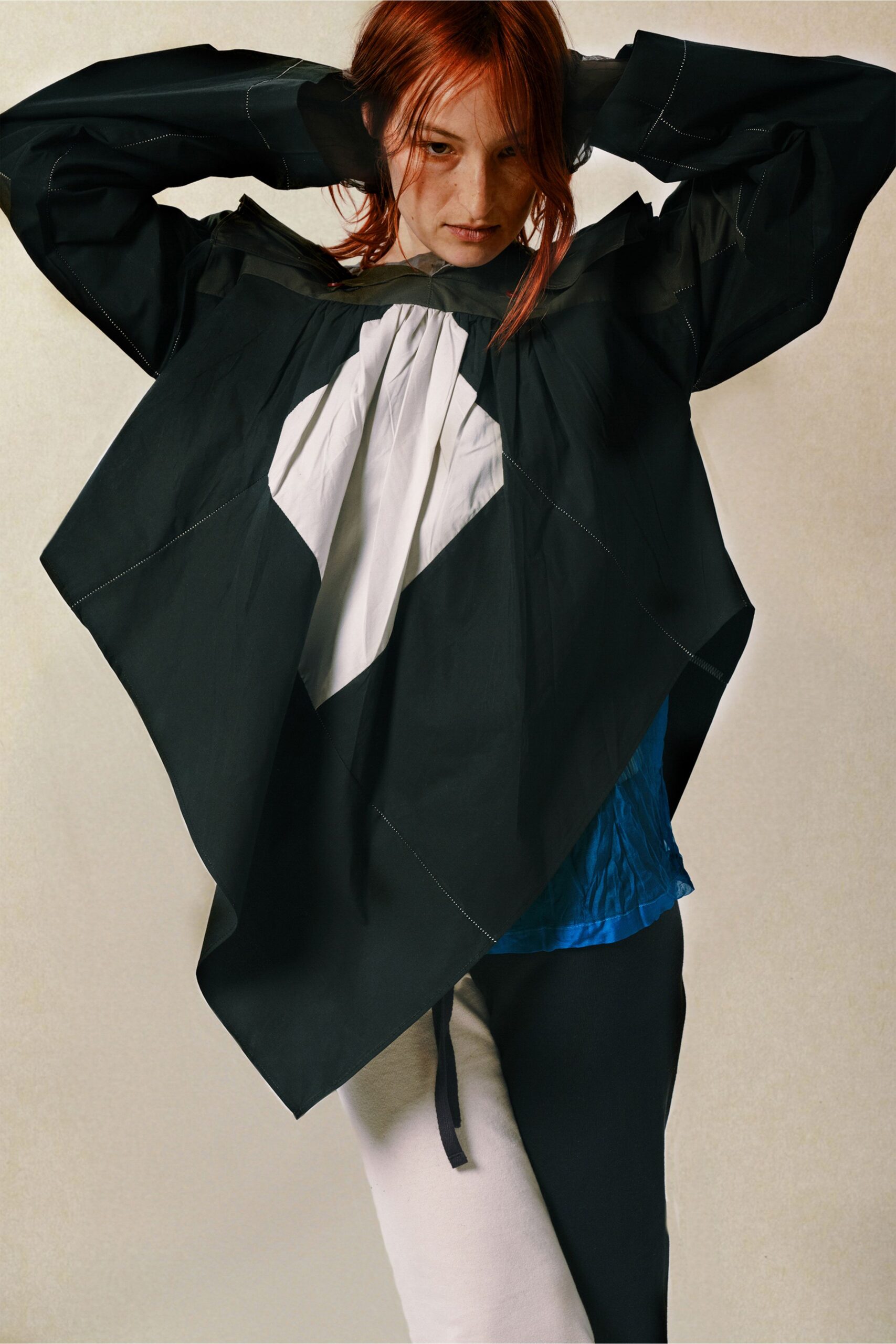 asymmetric black and white top with blue underlayer