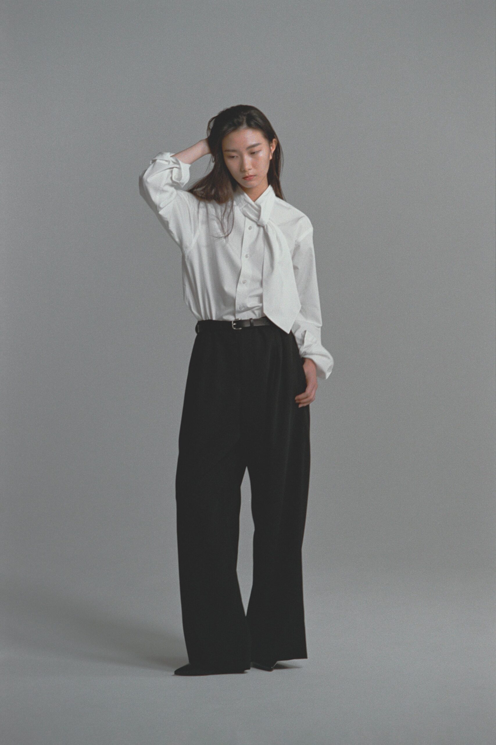 white relaxed shirt black wide-leg pants