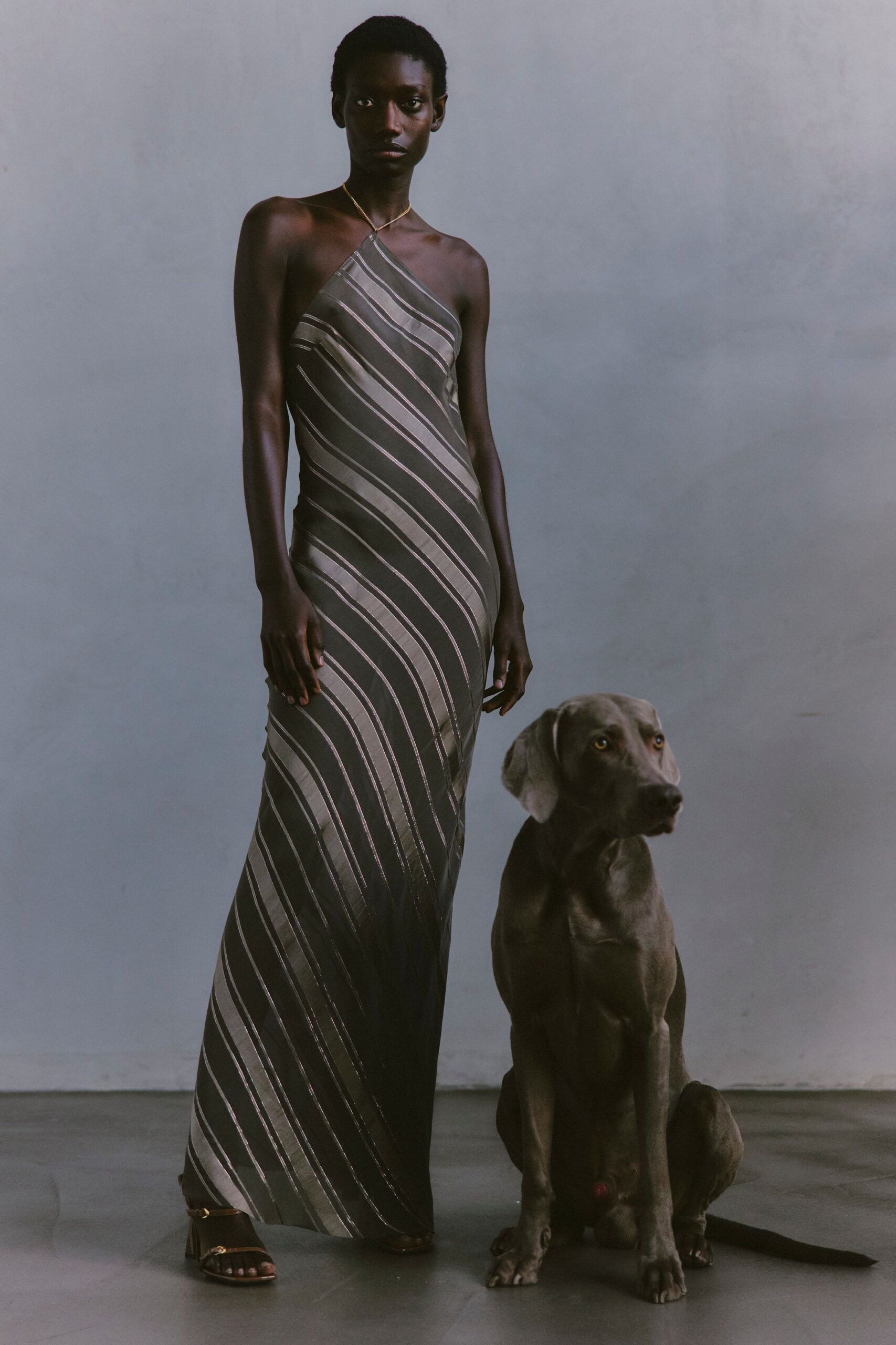 black silk sleeveless halter fitted striped flowing gown