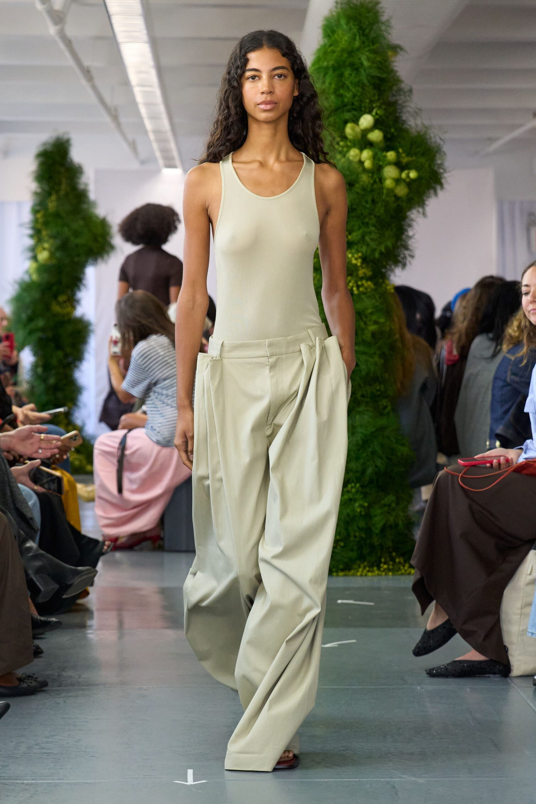 beige bodysuit and relaxed pants
