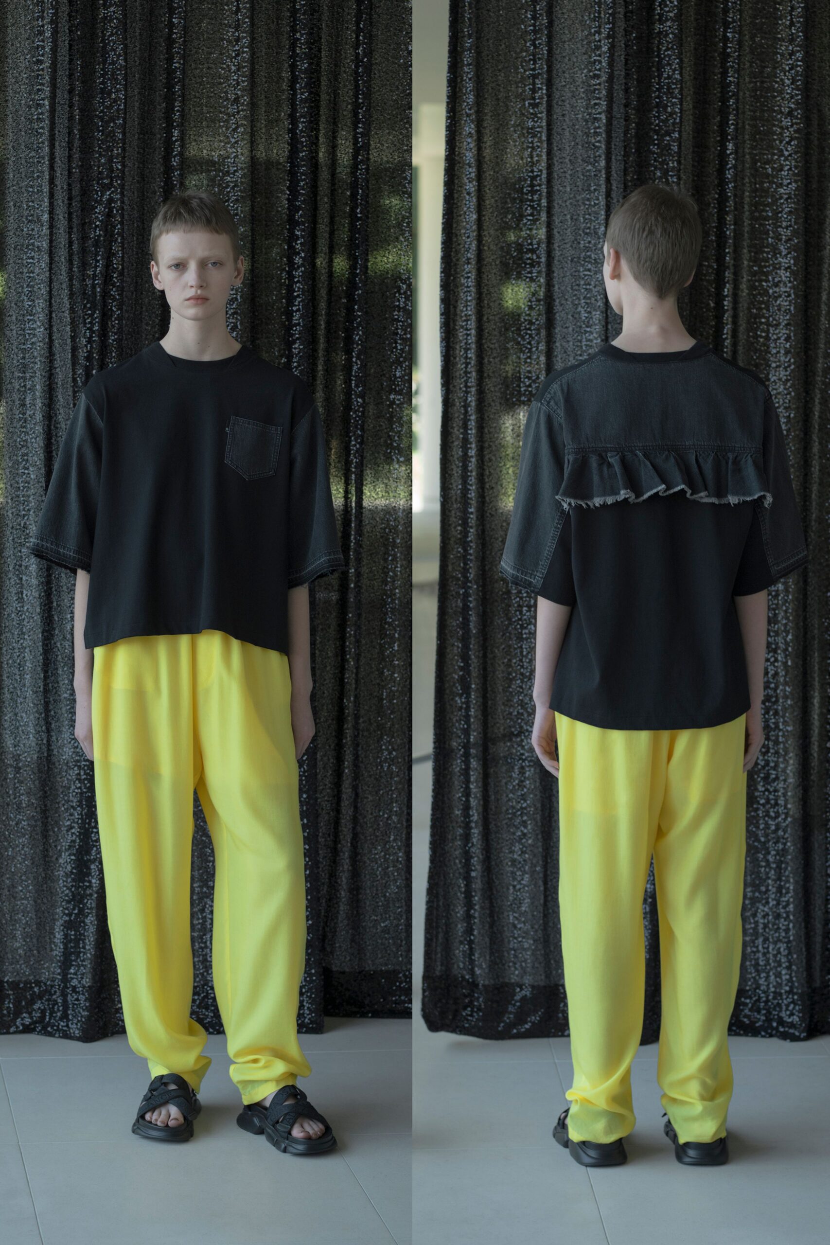black relaxed top and yellow pants