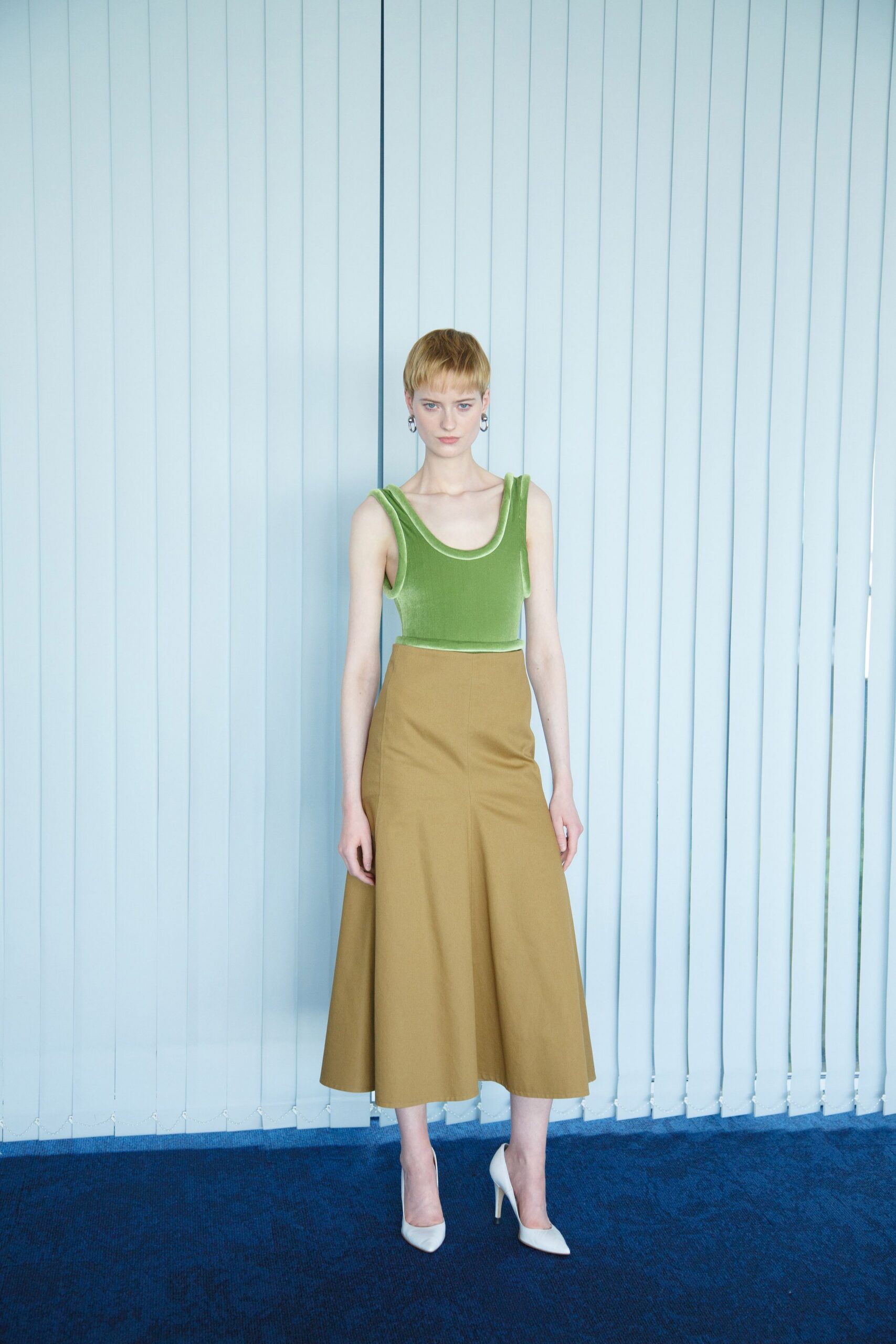 green velvet sleeveless high-neck fitted top
