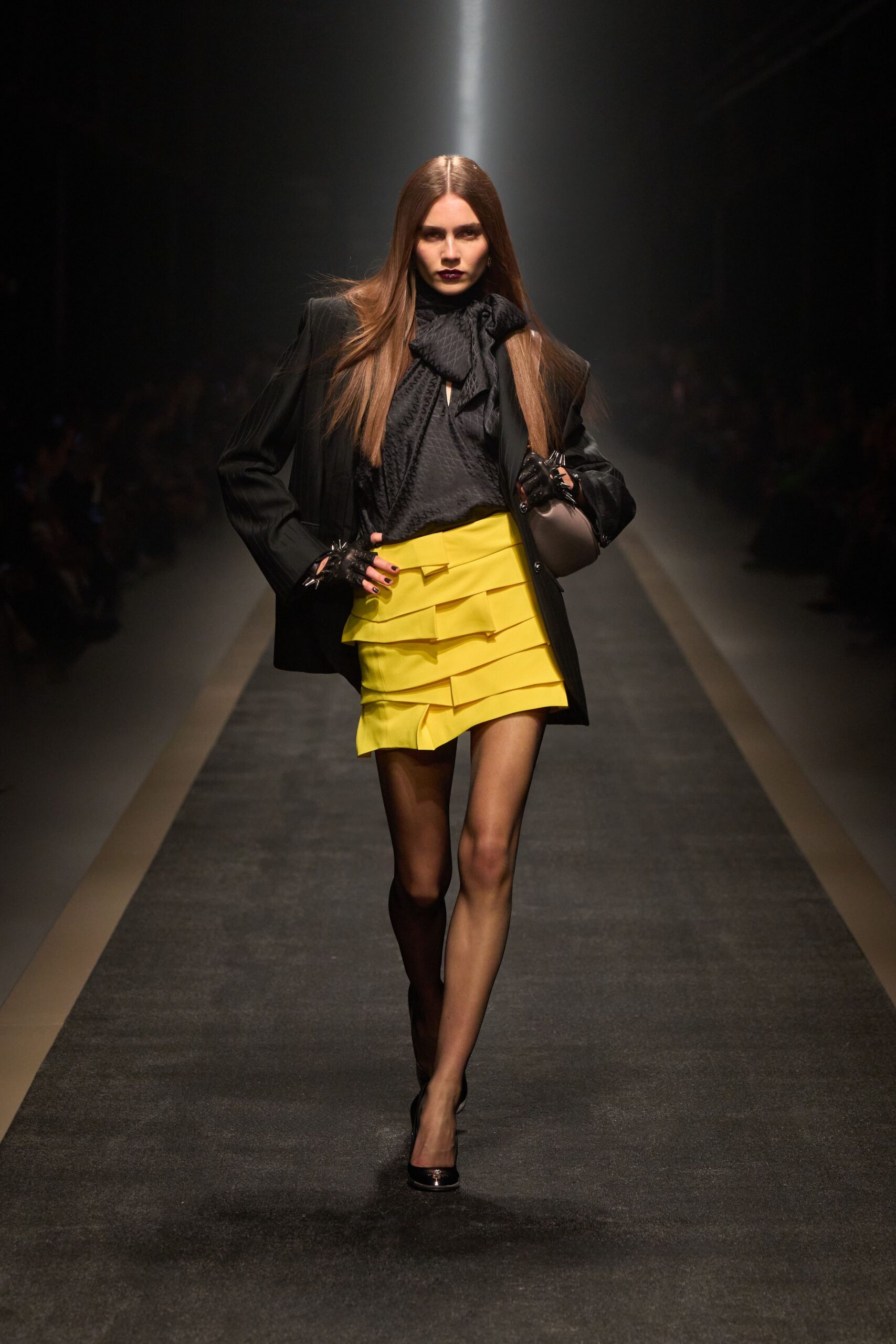 black blazer yellow pleated skirt