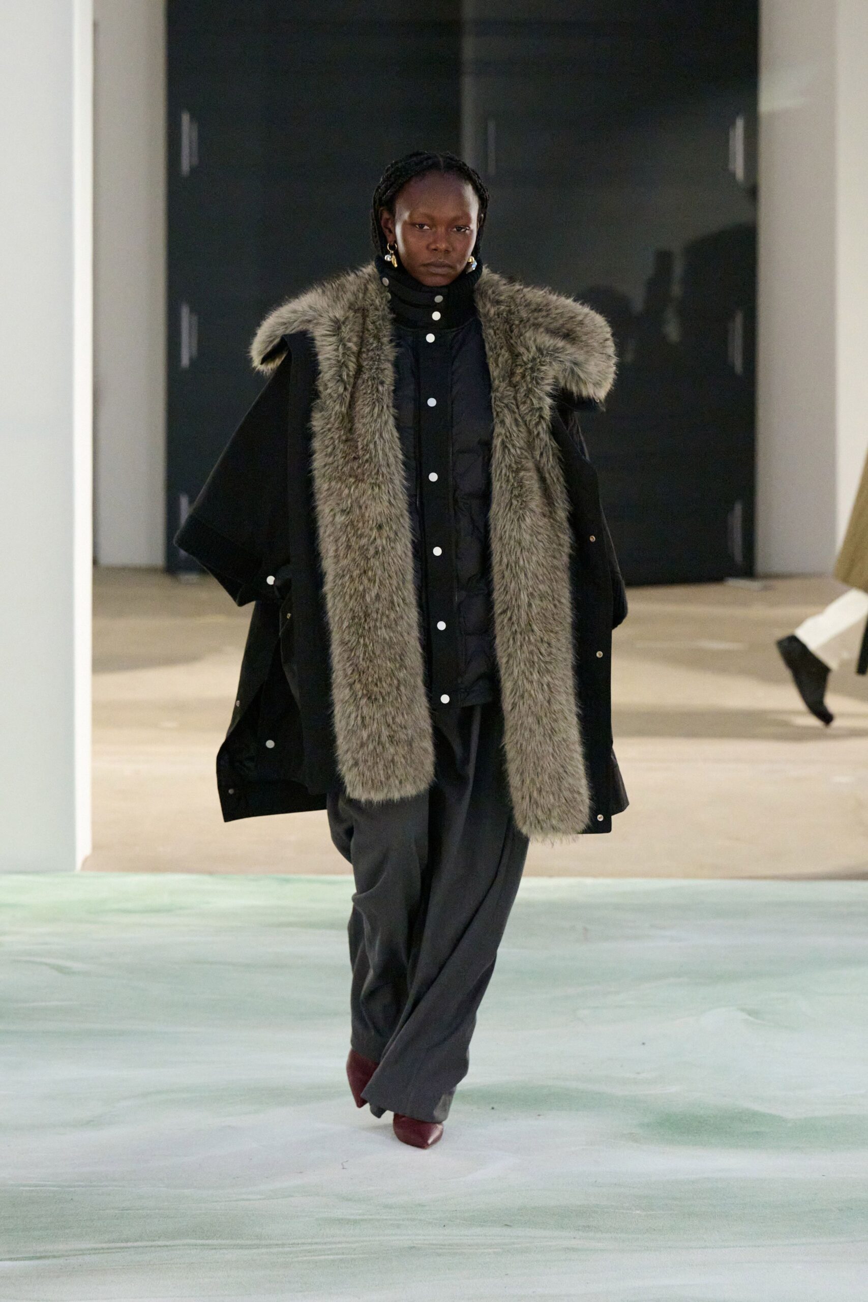 black coat and pants with red shoes