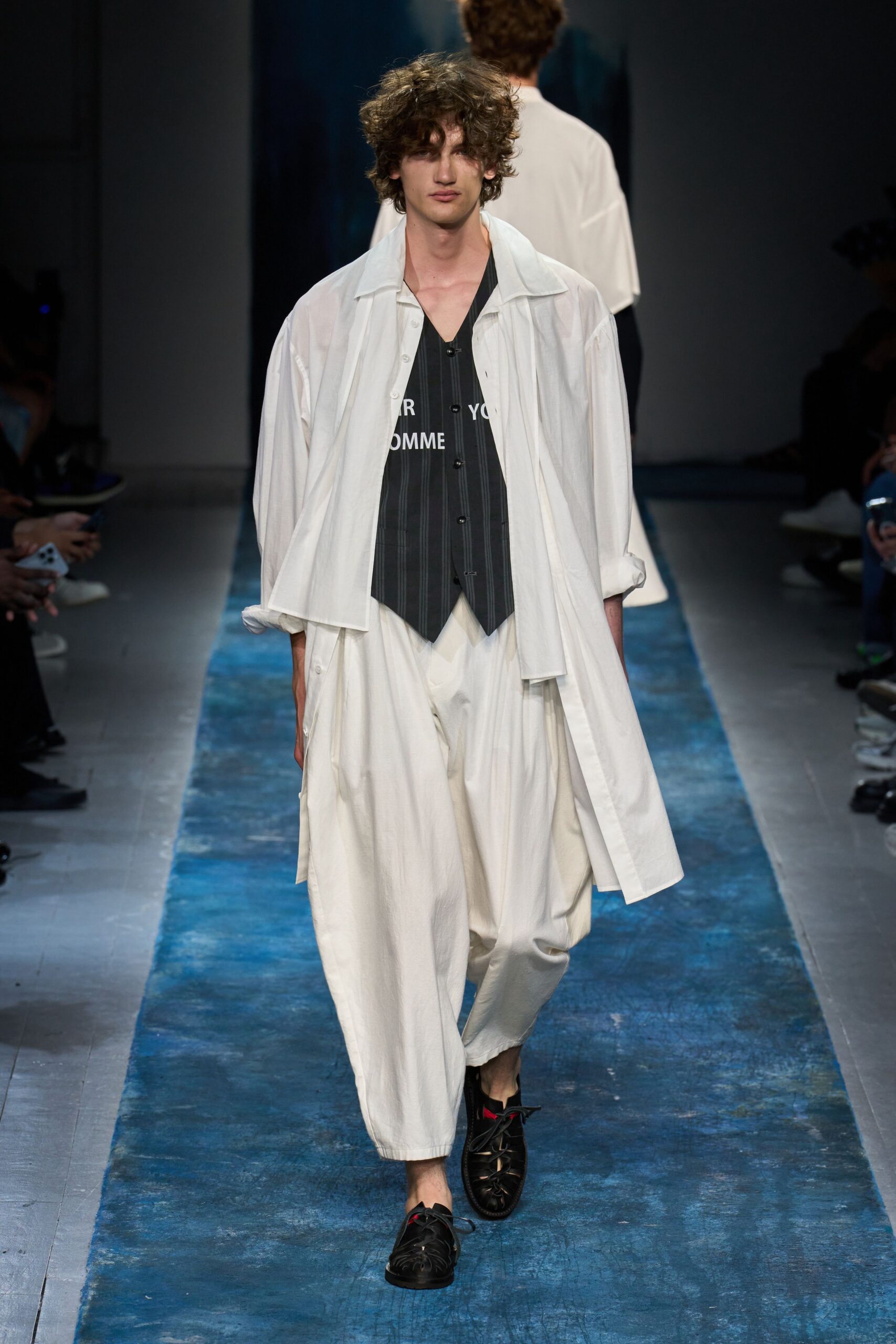 white relaxed shirt with black vest