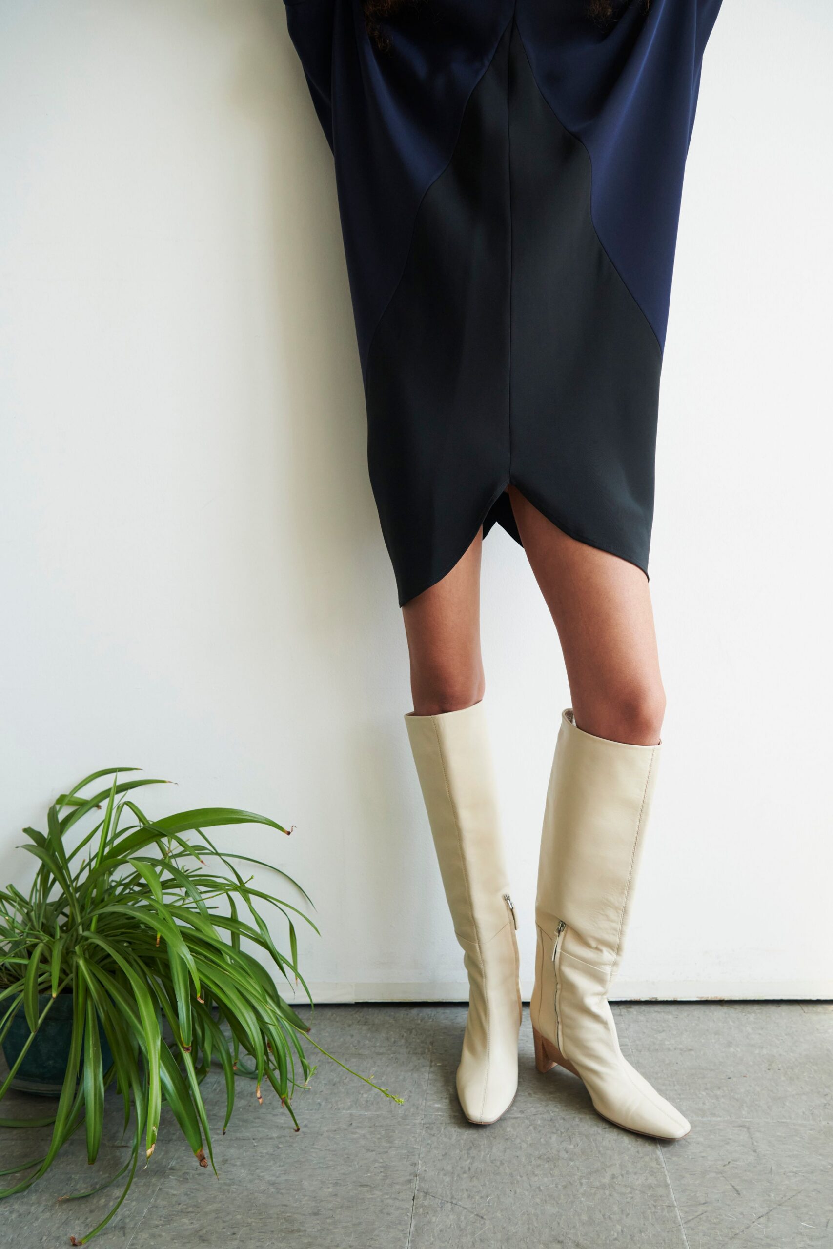 blue black asymmetric dress with white boots