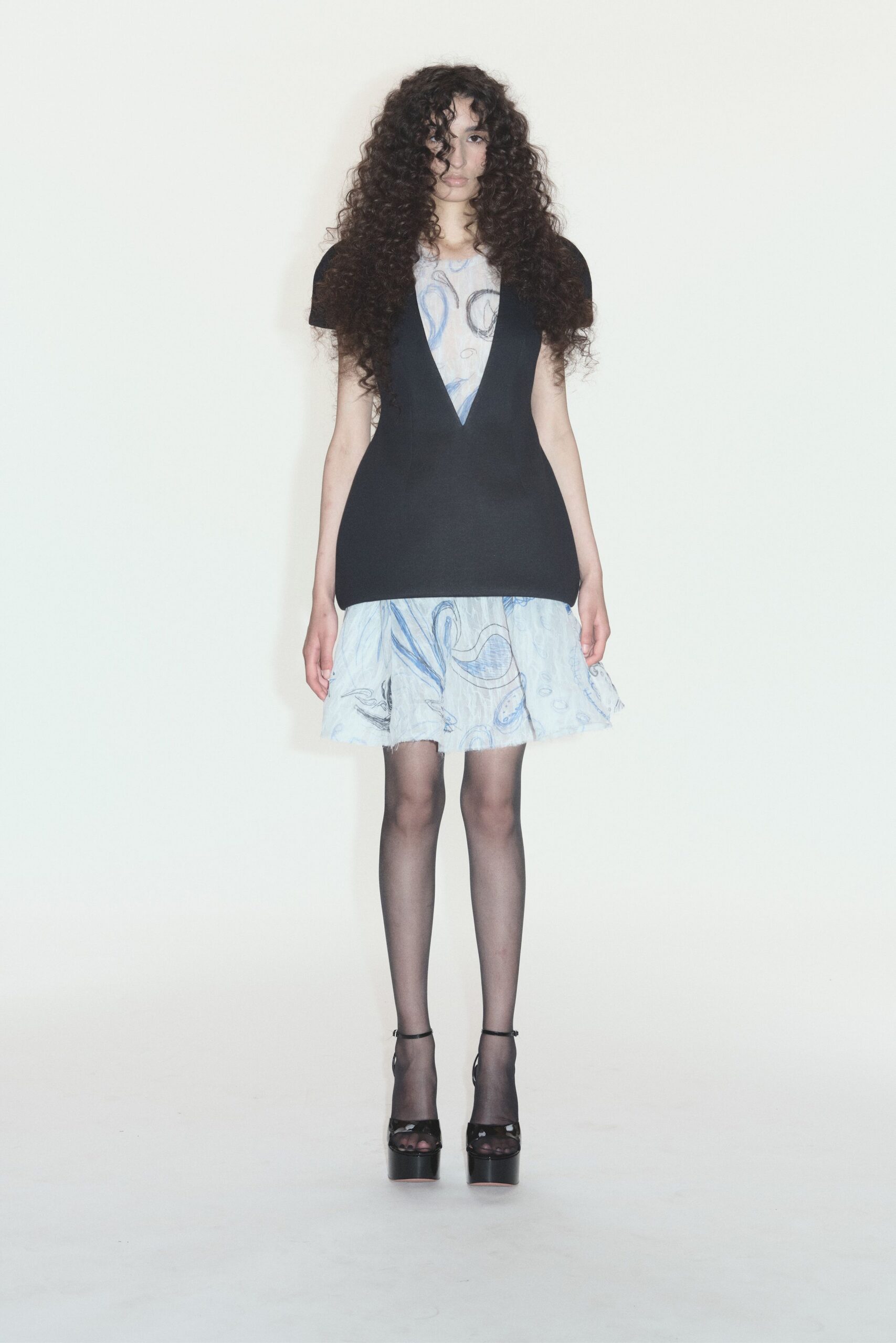 black and blue ruffled dress with heels