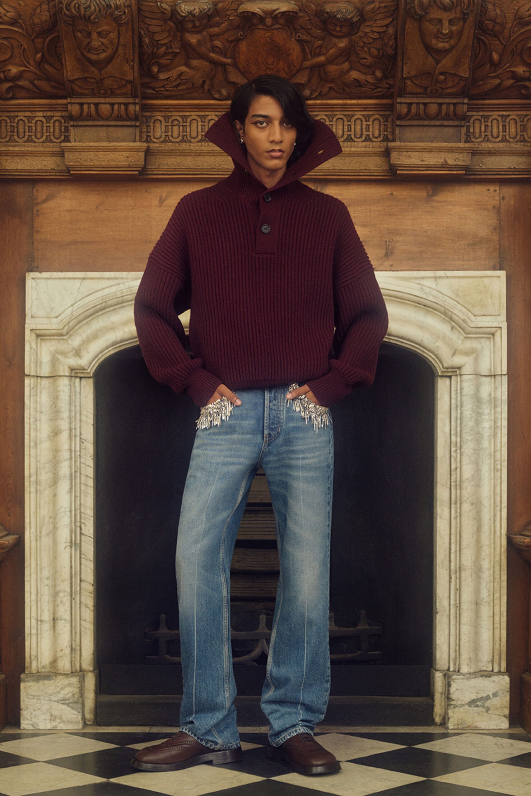 maroon wool sweater with blue jeans