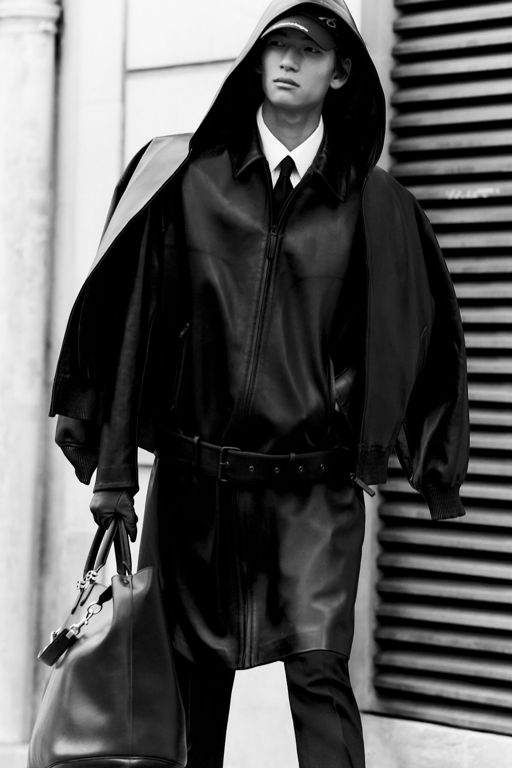 black leather long-sleeve hooded oversized zippered pockets coat