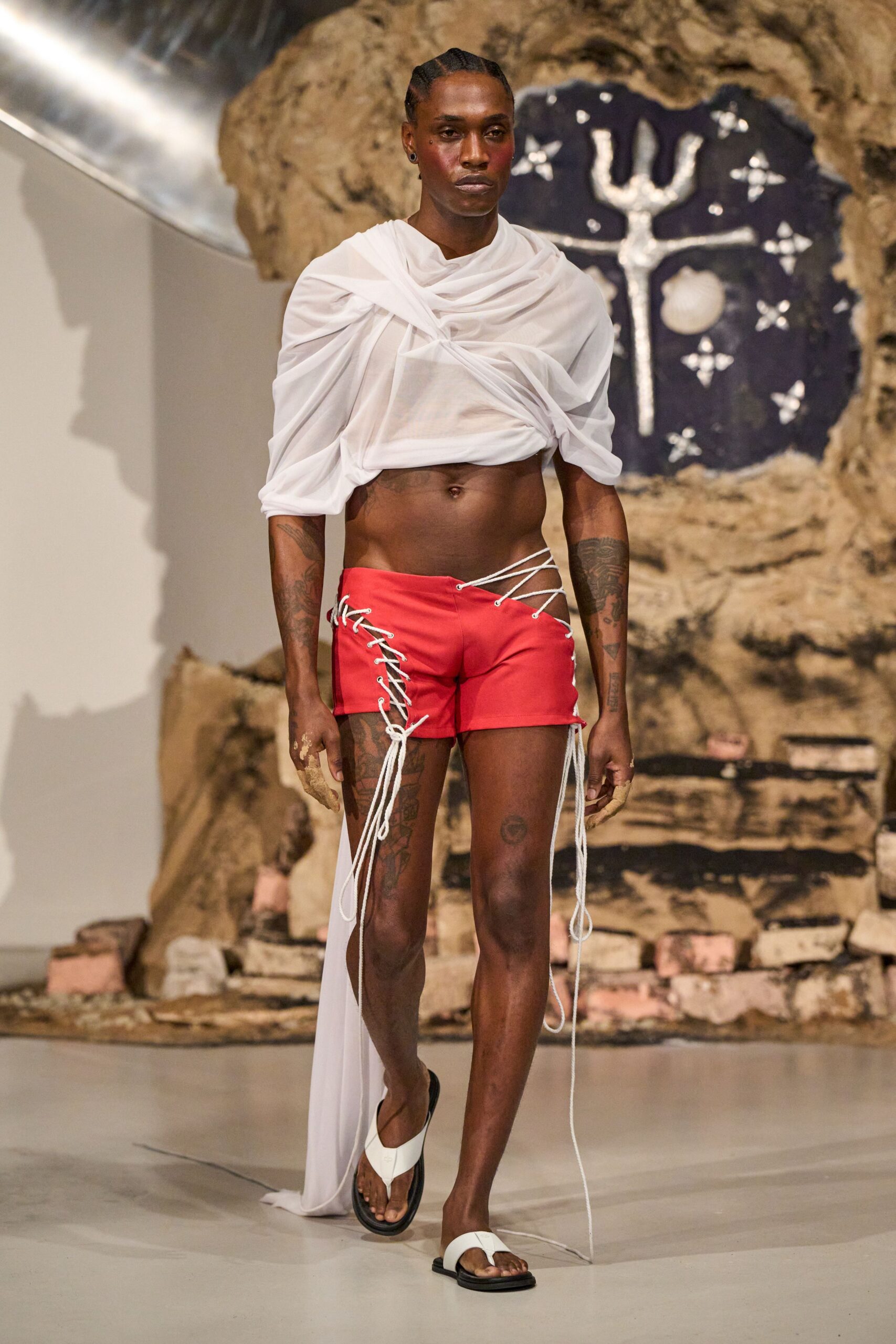 white draped top red shorts