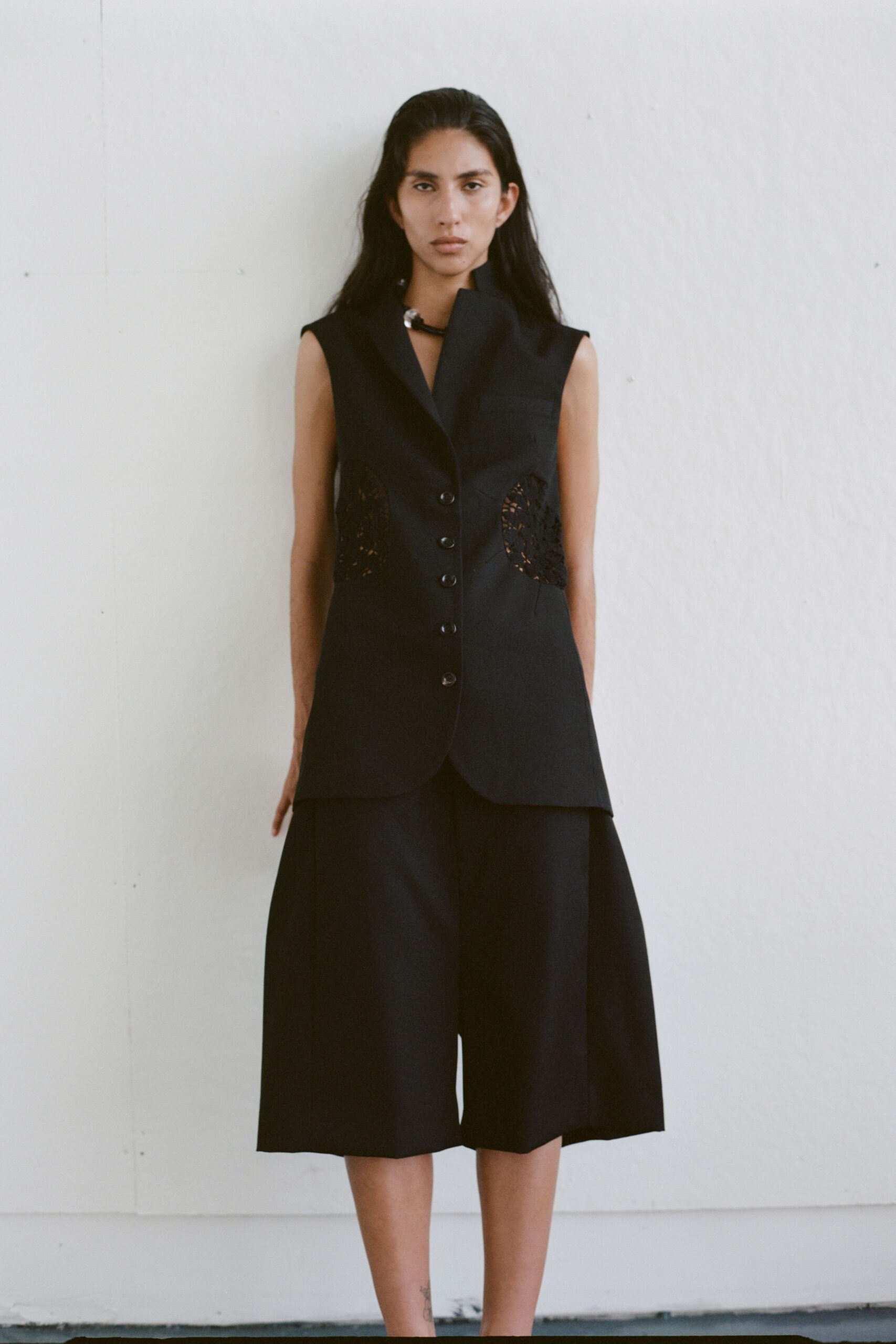 black fitted vest with culottes