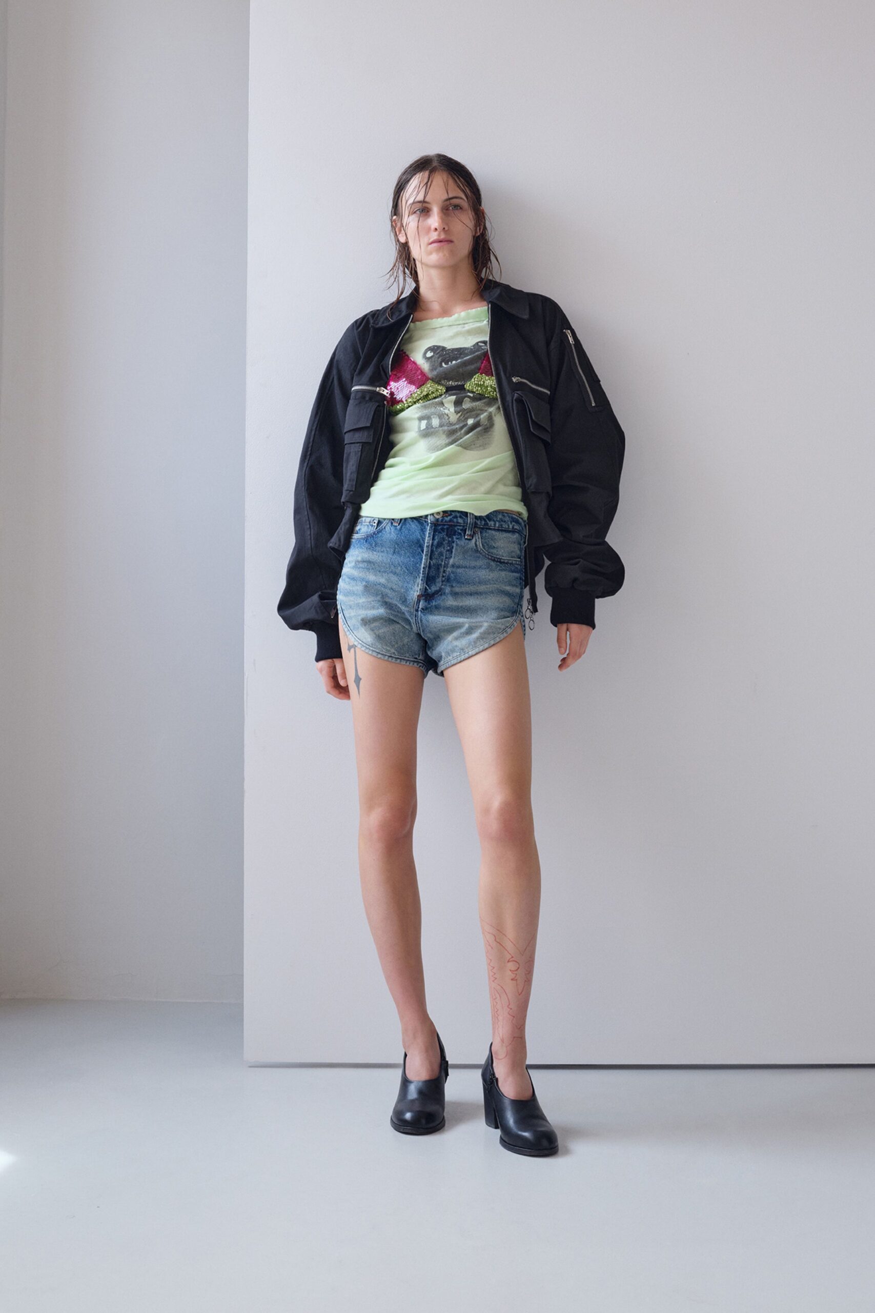 black oversized jacket with green t-shirt