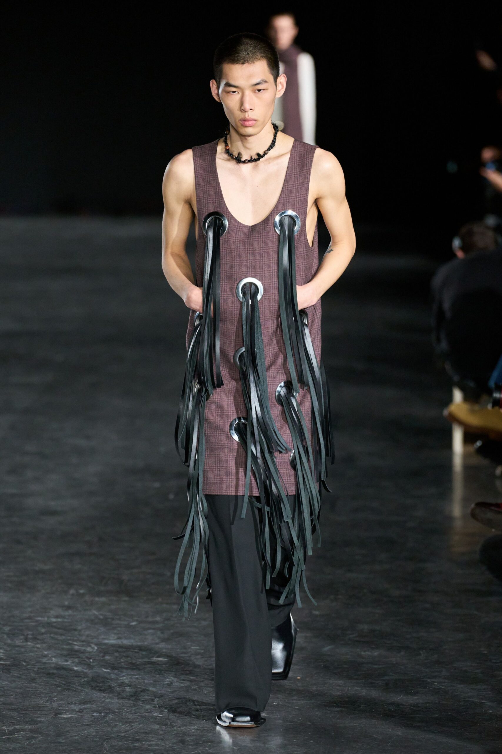 brown sleeveless dress with black pants
