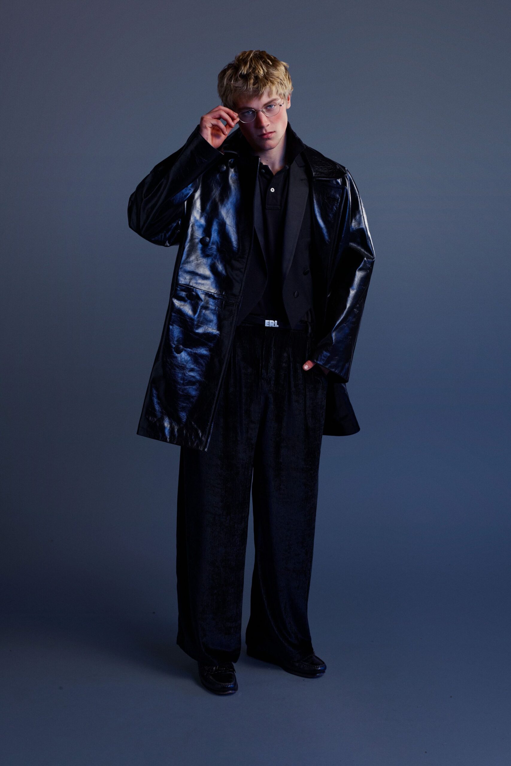 black vinyl coat with relaxed fit