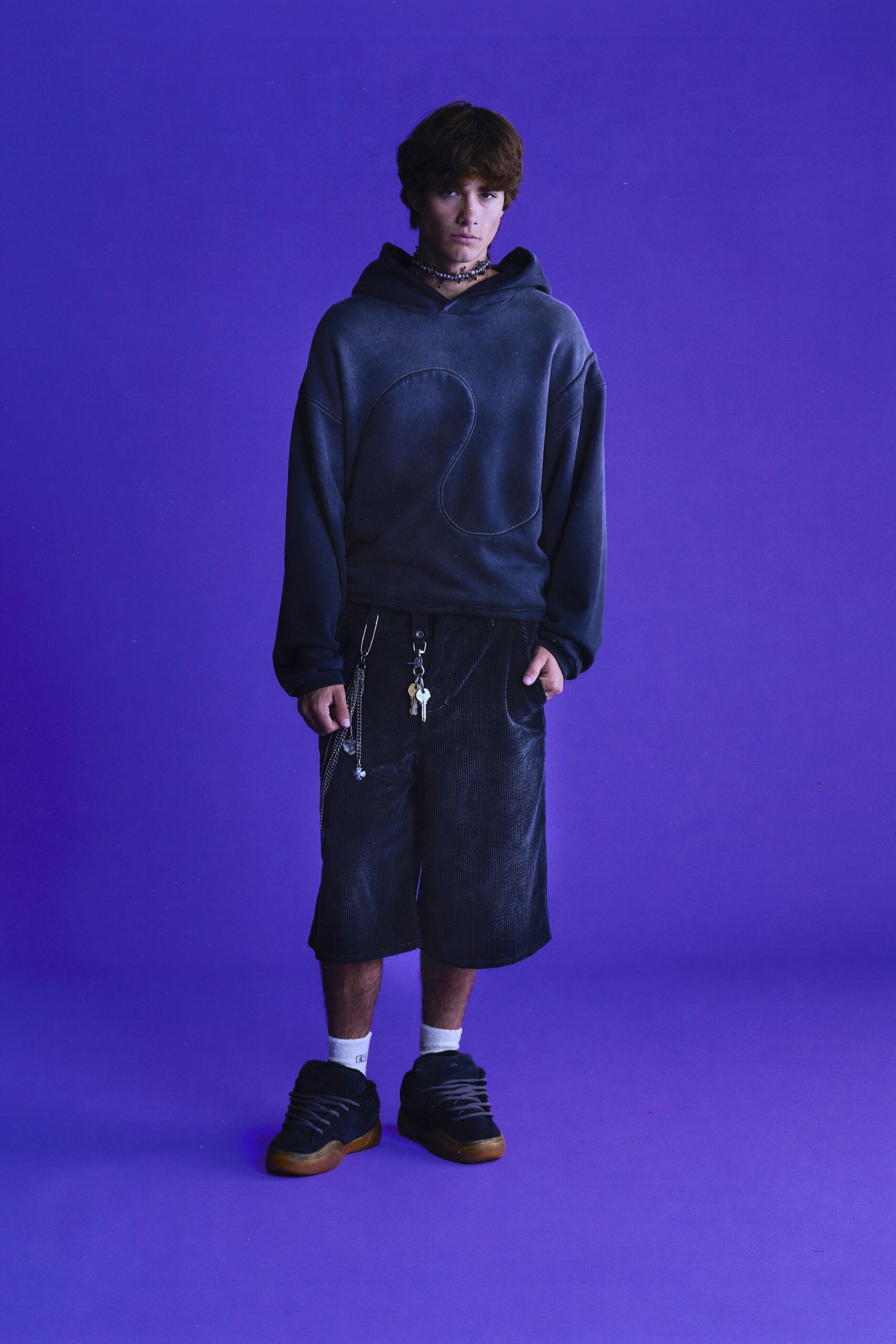 black oversized hoodie and cargo shorts