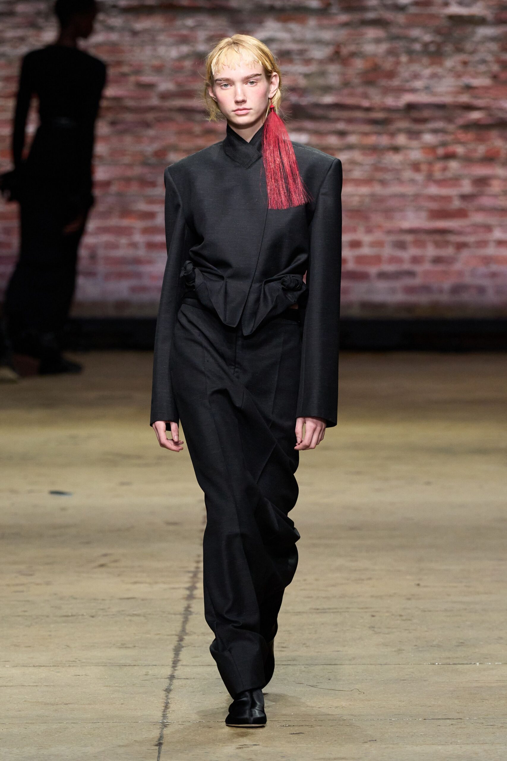 black fitted suit with straight-leg pants